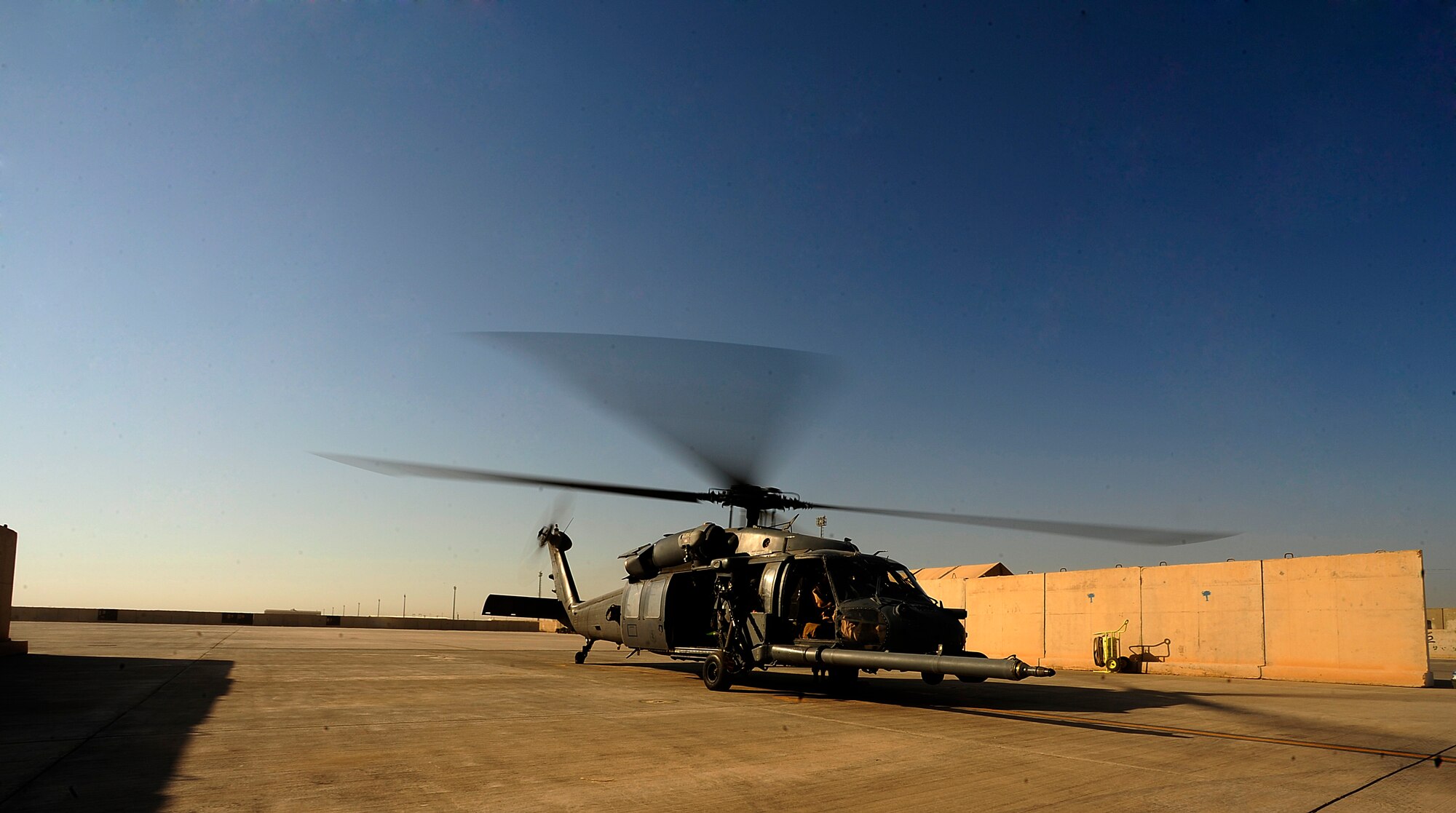 U.S. Air Force HH-60G PaveHawk helicopter aircrew assigned to the 64th Expeditionary Rescue Squadron start engines for a flying mission at Joint Base Balad, Iraq, July 12, 2010. (U.S. Air Force photo by Staff Sgt. Andy M. Kin / Released)