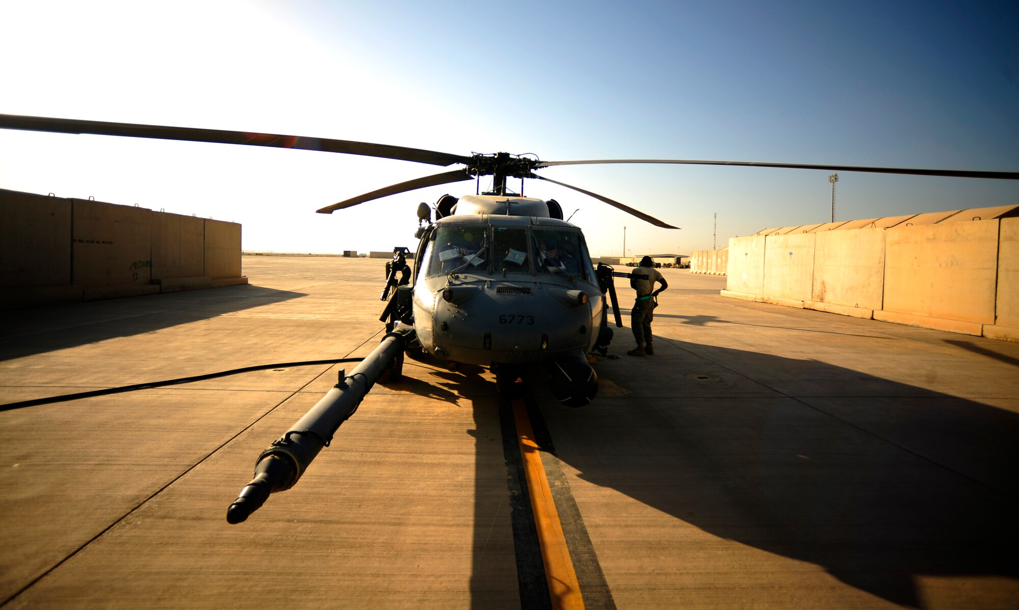 A U.S. Air Force HH-60G PaveHawk helicopter assigned to the 64th Expeditionary Rescue Squadron gets a pre-flight inspection by aircrew before a flying mission at Joint Base Balad, Iraq, July 12, 2010. (U.S. Air Force photo by Staff Sgt. Andy M. Kin / Released)