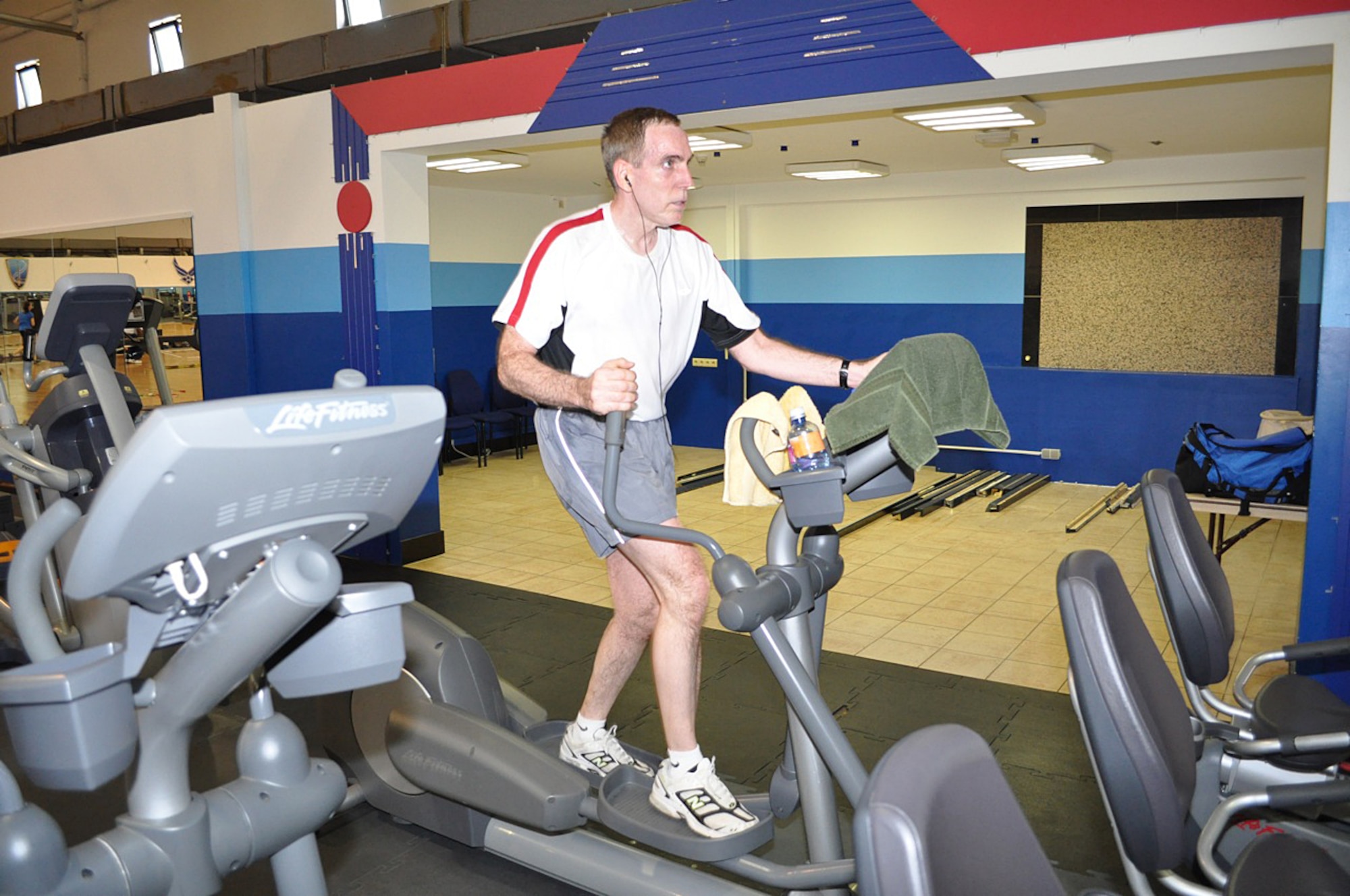 Col. Joseph Mastrianna, U.S. Air Forces in Europe Manpower, Personnel, and Services deputy director, is in the zone during his five-hour elliptical marathon June 4, 2010. He "ran" a total of 12,500 miles in just over three years on an elliptical machine to earn 1 million points for the Presidential Champion Platinum Award, which was presented July 22, 2010. (Courtesy photo)