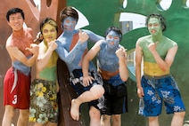 KUNSAN AIR BASE, Republic of Korea -- Visitors to the South Korea Boryeong Mud Festival pose for a photo after having their bodies painted with colored mud July 25. The festival, now in its 13th year, is one of the most popular tourist attractions in South Korea annually. (U.S. Air Force photo/Staff Sgt. Jonathan Pomeroy)
