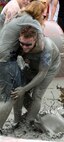 KUNSAN AIR BASE, Republic of Korea -- Participants at the South Korea Boryeong Mud Festival wrestle with each other inside one of the mud pits July 25. The festival, now in its 13th year, is one of the most popular tourist attractions in South Korea annually. (U.S. Air Force photo/Staff Sgt. Jonathan Pomeroy)