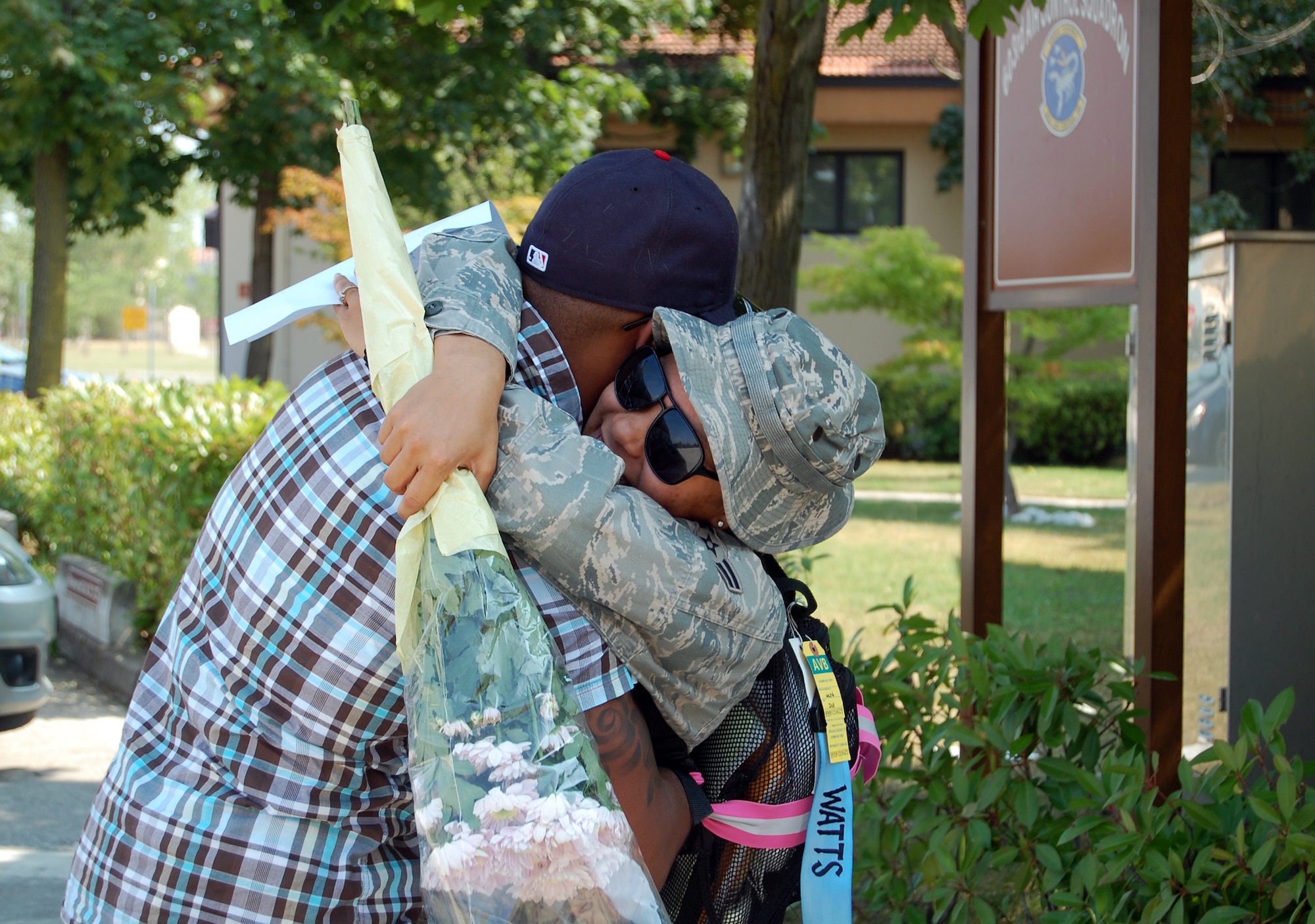 Airman 1st Class Trevor Watts, 31st Maintenance Squadron, welcomes home his wife Airman 1st Class Rachel Watts, 603rd Air Control Squadron, upon her return home to Aviano Air Base, Italy, July 23, 2010 from a six-month deployment to an unidisclosed location in Southwest Asia. More than 90 Airmen assigned to the 603rd ACS returned between July 12-23 from Kandahar, Afghanistan, and another undisclosed location downrange where they were conducting battle management of radio, radar and link support of Combined Forces Air Component commander objectives and supporting ground commander objectives by vectoring aircraft to troops in contact. (U.S. Air Force photo by Tech. Sgt. Lindsey Maurice/Released) 