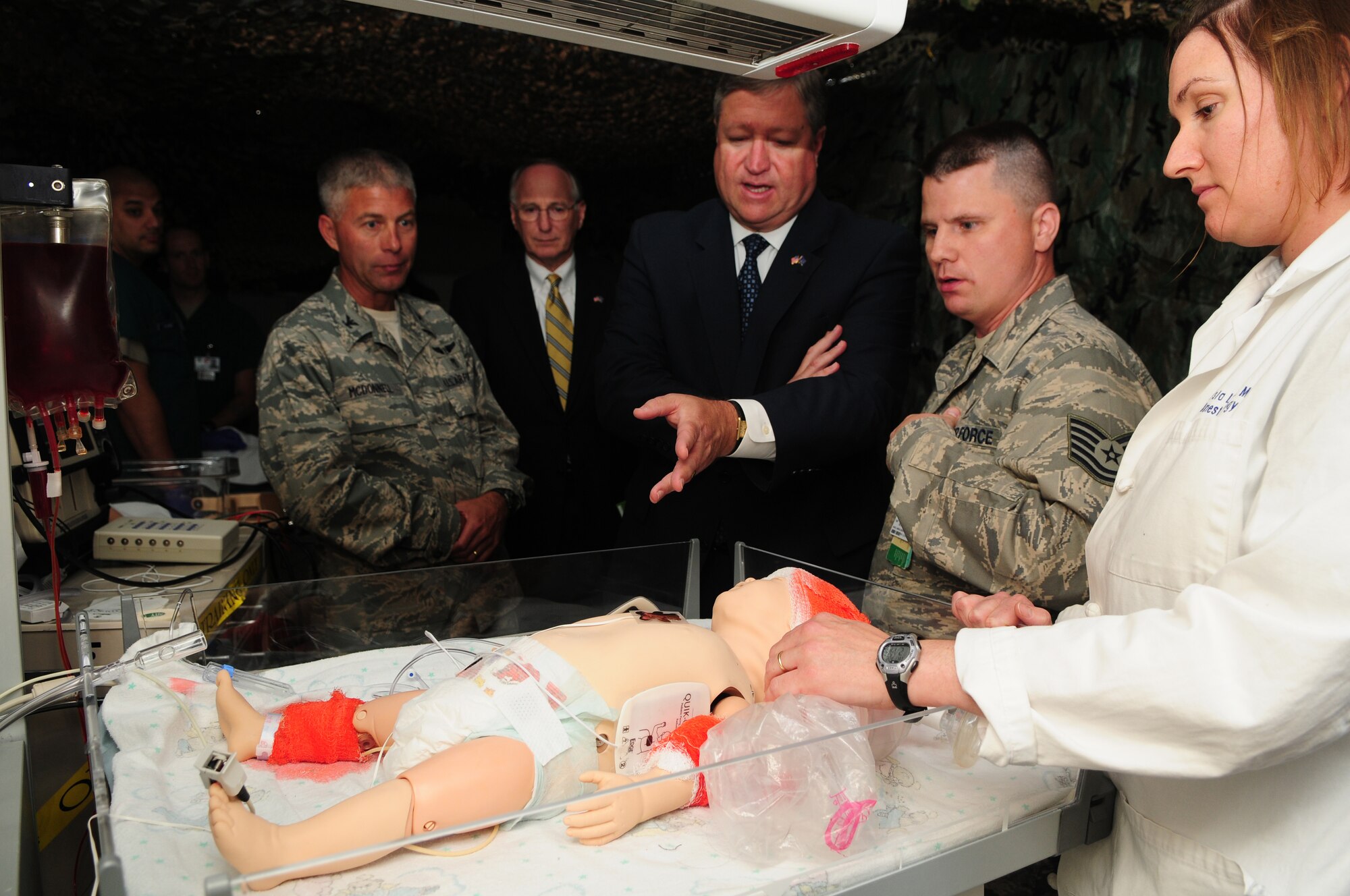 Secretary of the Air Force Michael Donley (center) observes a medical training demonstration by the 48th Medical Group at Royal Air Force Lakenheath, England, on July 22, 2010. Secretary Donley also visited the 48th Mission Support Group Youth Center, the 48th Maintenance Group engine shop and the 48th Operations Group Strike Eagle Complex at RAF Lakenheath. (U.S. Air Force photo/Airman 1st Class Lausanne Morgan)