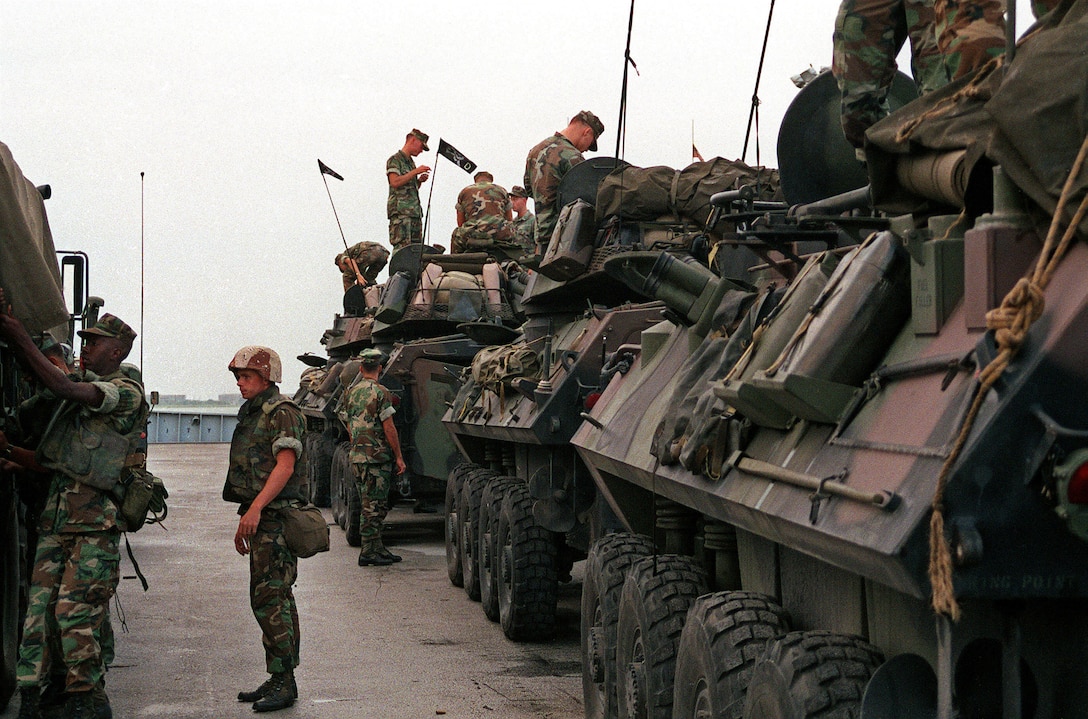 U.S. Marines prepare their LAV-25 light armored vehicles aboard Navy ships in preparation for shipment to Saudi Arabia in support of Operation Desert Shield..