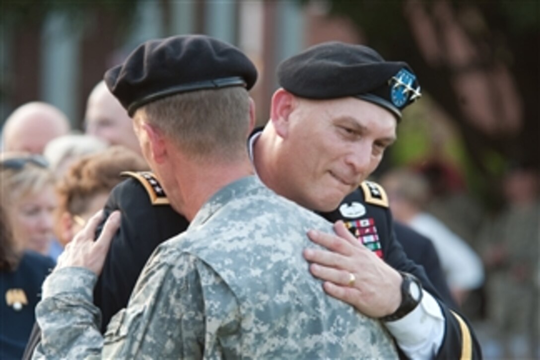 Commanding General United States Forces - Iraq Gen. Ray Odierno embraces Gen. Stanley A. McChrystal at the conclusion of McChrystal's retirement ceremony at Fort McNair in Washington, D.C., on July 23, 2010.  McChrystal retired from the U.S. Army after 34 years of service to his nation during both peace and wartime.  