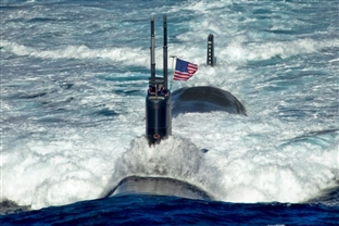 The attack submarine USS Tuscon sails through the East Sea, July 26, 2010, while leading a 13-ship formation participating in the combined alliance maritime and air readiness exercise "Invincible Spirit." The United States and South Korea are conducting the exercise  in the seas east of the Korean peninsula from July 25-28, 2010. This is the first in a series of joint military exercises that will occur over the coming months in the East and West seas. 