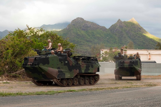 U.S. Marines assigned to 3rd Marine Regiment utilize amphibious assault vehicles to set up a cordon around a mock U.S. embassy during a noncombatant evacuation operation at Marine Corps Training Area Bellows, Hawaii, July 26. The NEO, an emergency evacuation involving the use of military forces and capabilities in order to provide aid, assistance and movement to safety of American citizens overseas, was conducted as part of interoperability training between coalition forces during the multi-national Exercise Rim of the Pacific 2010.