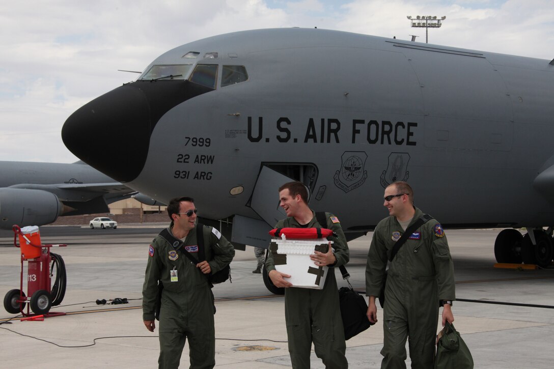 Crewmembers of a U.S. Air Force KC-135R Tanker, from the 22nd Air Refueling Wing, out of McConnell Air Force Base, Kan., walk off the flight line at Nellis Air Force Base, Nev., July 27. The crew participated in Red Flag 10-4 and their mission was to refuel aircraft and on July 27, they refueled United States Marine Corps F-18 Hornets and an EA-6B Prowler. (Left to right) Capt. Andrew P. Bowers, KC-135R pilot, 1st Lt. Sean P. O’Malley, KC-135R co-pilot, Senior Airman Justin M. Miller, KC-135R boom operator.