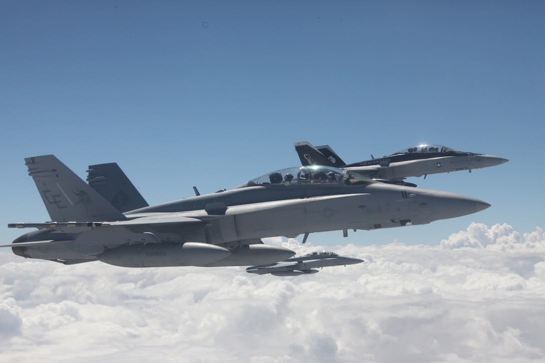 Three F-18 Hornets fly at an approximate height of 20,000 feet in the Nevada skies, July 27. The Hornets are from Marine Fighter Attack Squadron 225, out of Marine Corps Air Station Miramar, Ca., and are participating in Red Flag 10-4, which is a two-week advanced aerial combat training exercise, hosted at Nellis Air Force Base, Nev. Red Flag is held four times a year.