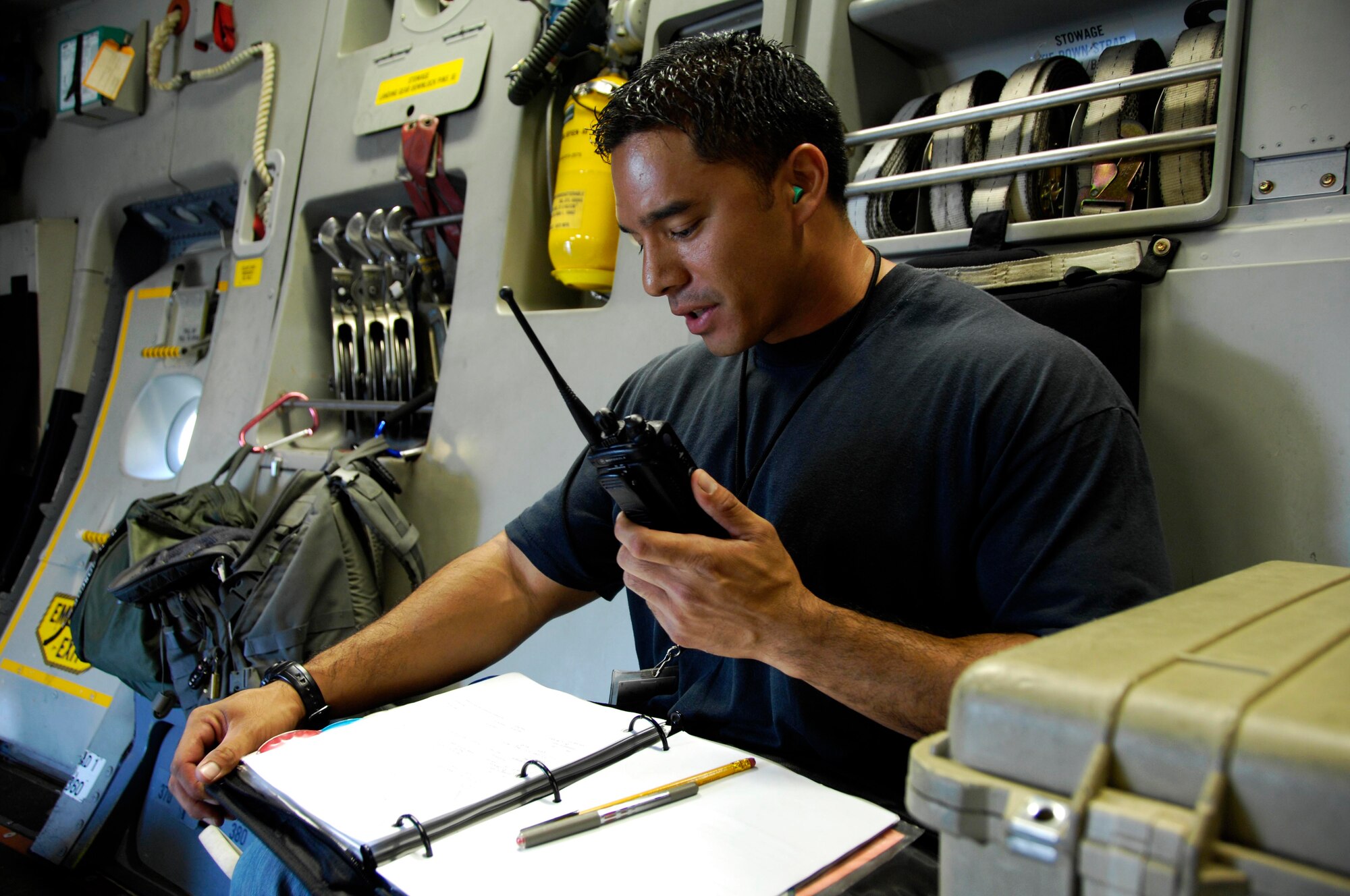 Tech. Sgt. Dustin Ching, 154th Aircraft Maintenance Squadron crew chief, makes aircraft documentation for a C-17 during pre-flight maintenance July 23. The sortie the C-17flew included a simulated cargo drop, in-flight refueling, and participation in a simulated fire fight as part of a Rim of the Pacific exercise. (U.S. Air Force photo by Staff Sgt. Nathan Allen)
