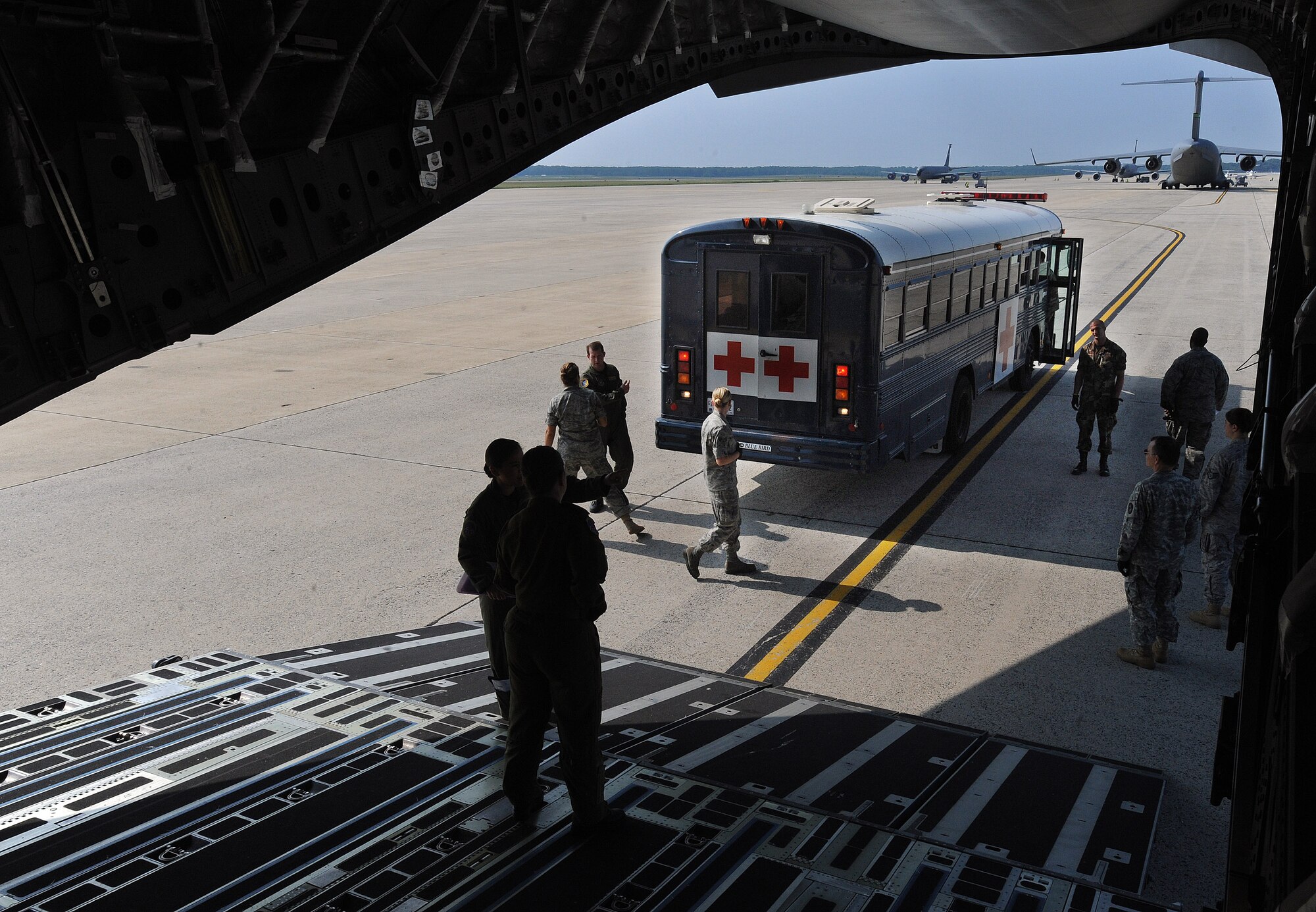 Aeromedical evacuation teams prepare to load patients on board a C-17 Globemaster aircraft at Andrews Air Force Base, Md., in preparation for the weekly Integrated Continental United States Medical Operations Plan mission or ICMOP mission as it's known by it's acronym. The mission picks up war wounded and other patients at Andrews AFB and returns them to their homes throughout the United States.   (U.S. Air Force photo by Master Sgt. Rick Sforza)