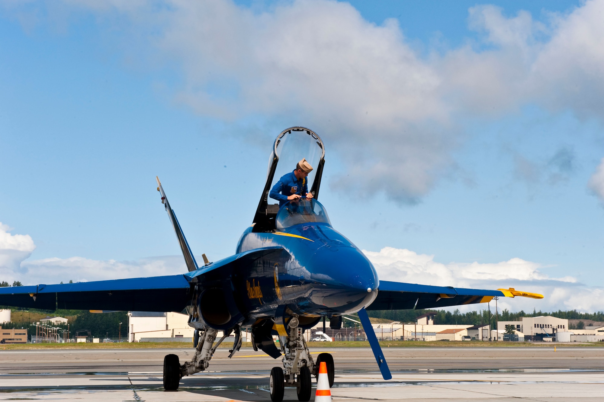 JOINT BASE ELMENDORF RICHARDSON, Alaska --U.S. Navy Blue Angels pilot exit his aircraft after arriving at Joint Base Elmendorf-Richardson July 27. The Blue Angels will be one of the main performances during this year?s Arctic Thunder Air Show, taking place July 31 and Aug. 1. Gates open at 9 a.m. and parking and admission are free. (Air Force photo by Airman 1st Class Jack Sanders)