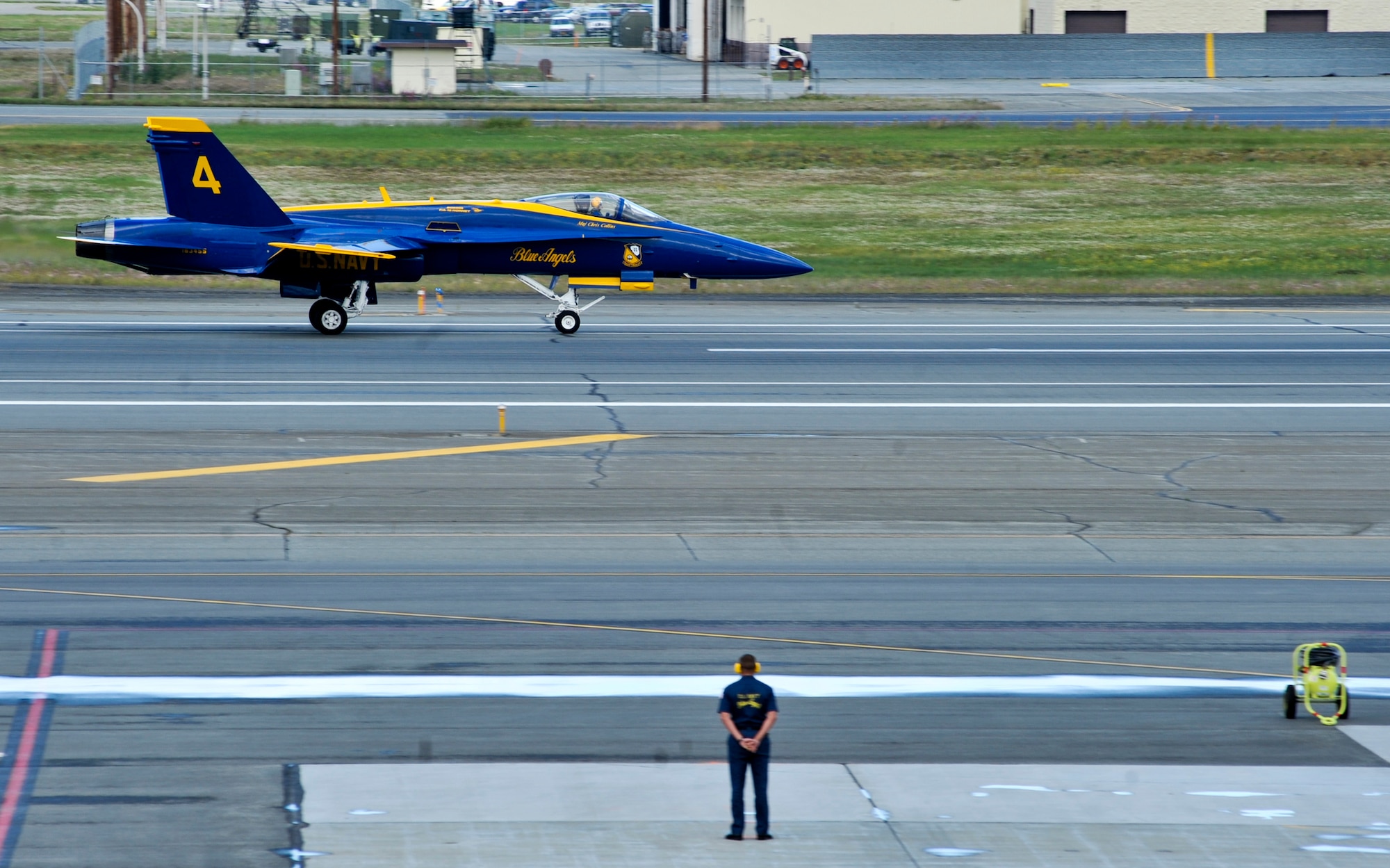 JOINT BASE ELMENDORF-RICHARDSON, Alaska – A Blue Angel makes his way down Joint Base Elmendorf-Richardson’s runway after landing here July 27. The Blue Angels will be one of the main performances during this year’s Arctic Thunder Air Show, taking place July 31 and Aug. 1. Gates open at 9 a.m. and parking and admission are free. (Air Force photo by Airman 1st Class Christopher Gross)