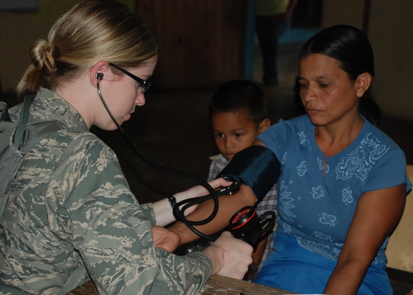 DUYURE, Honduras -- Air Force 1st Lt. Nicole Musshorn, a registered nurse in Joint Task Force-Bravo's Medical Element, takes a Honduran woman's blood pressure during a Medical Civic Assistance Program here July 20. During the MEDCAP, a team of Honduran health care providers and JTF-Bravo personnel provided medical care to 435 Duyure residents in need. (U.S. Air Force photo by 1st Lt. Jen Richard)