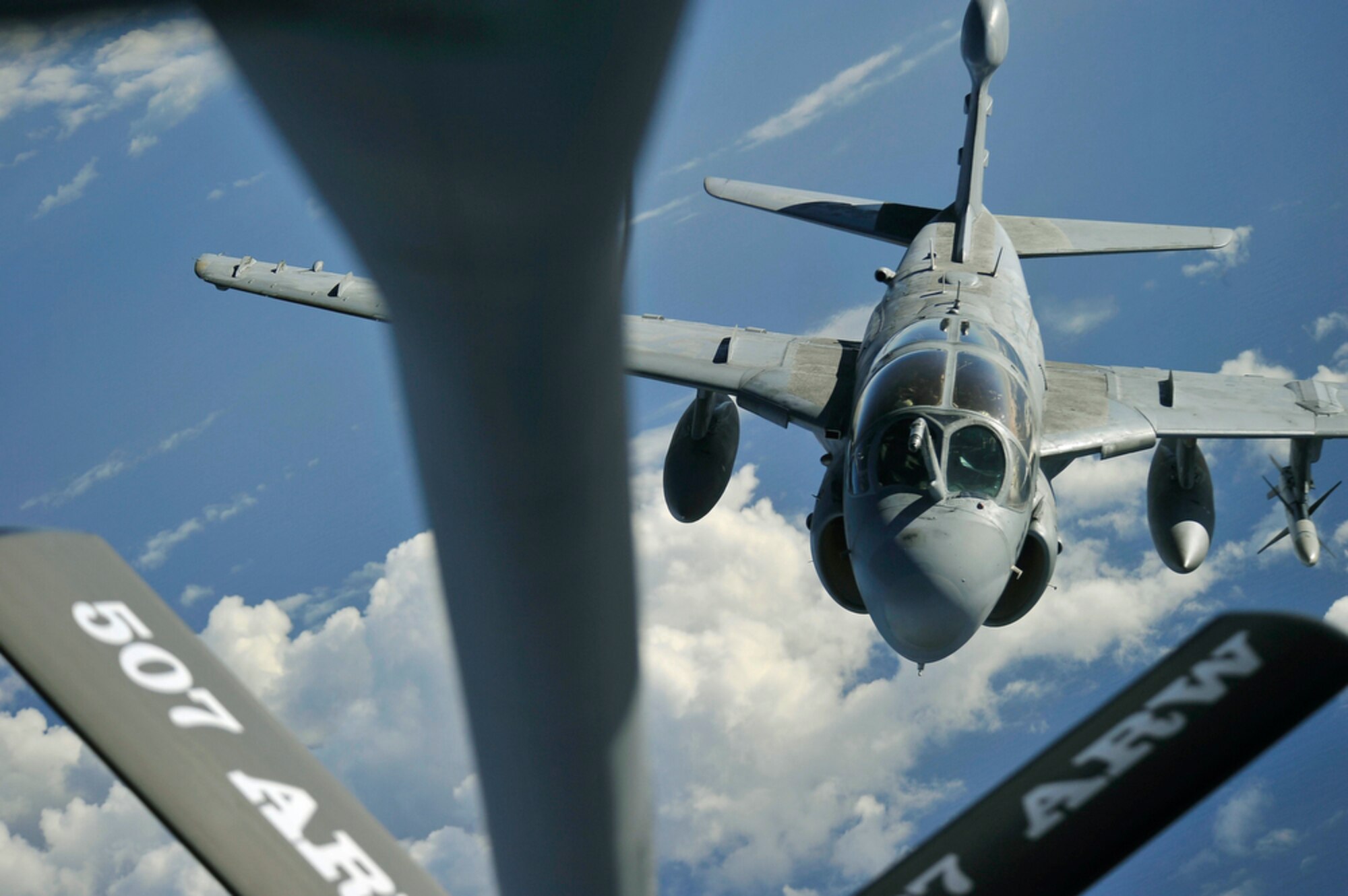 A U.S. Navy EA-6 Prowler flying over Hawaiian air space July 20, 2010, moves into position to receive fuel from a KC-135 Stratotanker from the 507th Air Refueling Wing at Tinker Air Force Base, Okla., during the Rim of the Pacific exercise. RIMPAC, the world's largest maritime exercise, is a biennial event which stresses interoperability among the 14 nations participating in the exercise. The tanker is staging out of Joint Base Pearl Harbor-Hickam, Hawaii.  (U.S.  Air Force photo/Tech Sgt. Cohen A. Young)
