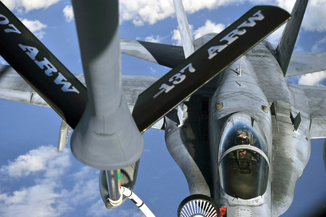 A U.S. Navy F/A-18F Super Hornet flying over Hawaiian air space July 20, 2010, receives fuel from a KC-135 Stratotanker from the 507th Air Refueling Wing at Tinker Air Force Base, Okla., during the Rim of the Pacific Exercise.  RIMPAC, the world's largest maritime exercise, is a biennial event which stresses interoperability among the 14 nations participating in the exercise. The tanker is staging out of Joint Base Pearl Harbor-Hickam, Hawaii.  (U.S.  Air Force photo/Tech Sgt. Cohen A. Young)