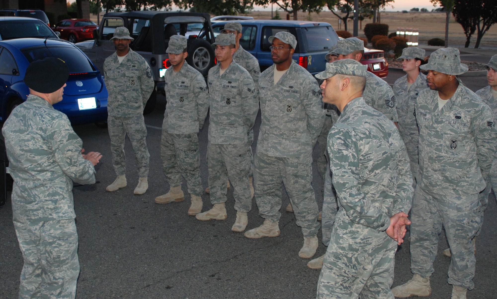 Maj. Edward Simpson, 9th Security Forces Squadron commander, addresses the first group of returning deployers July 26 outside the 9th SFS headquarters building. The 26 total Airmen were deployed to Bagram Airfield, Afghanistan and protected the base from multiple attacks from insurgents. (Photo by Airman 1st Class Chuck Broadway)