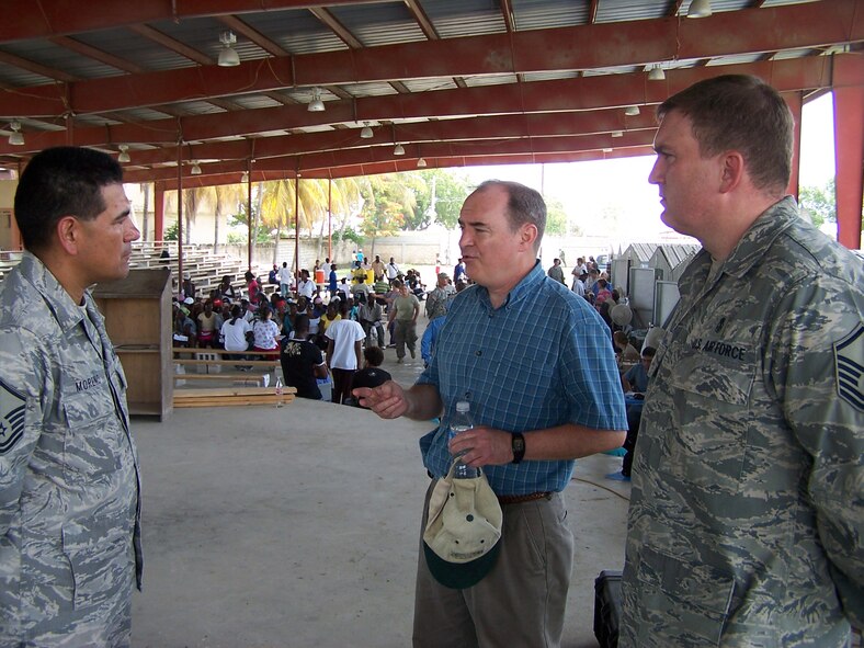 Master Sgt. Brian McMahan (right) and Master Sgt. Moreno (left), both 20th Medical Group members, give a mission brief to the Assistant Ambassador to Haiti.  The 20th MDG were the first team to arrive in Haiti to support the New Horizons Haiti mission. The 20th MDG Airmen set up a medical outreach at Saint-Marc, Haiti, about 60 miles north of Port-au-Prince during the two and a half week deployment. (Courtesy photo)