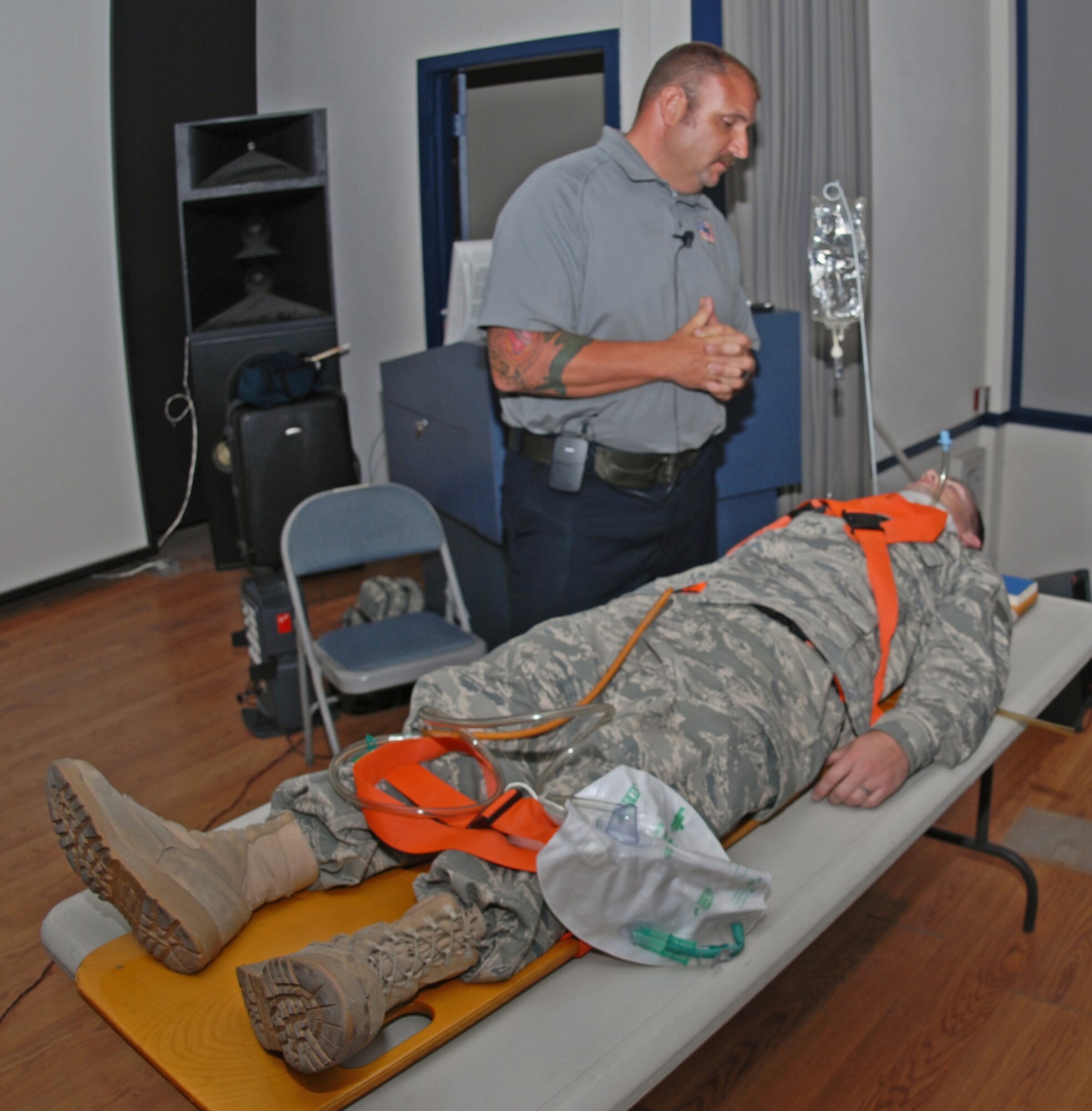CREECH AFB, Nev. -- Pat Kelly performs life saving procedures on a volunteer during the Stay Alive From Education (SAFE) Street Smart briefing.  The demonstration showed Airmen first -hand the consequences of drinking and driving and not wearing a seat belt.  Mr. Kelly is a firefighter from Orlanda, Fla. working in conjunction with Anheuser Busch in their SAFE program. (U.S. Air Force Photo)