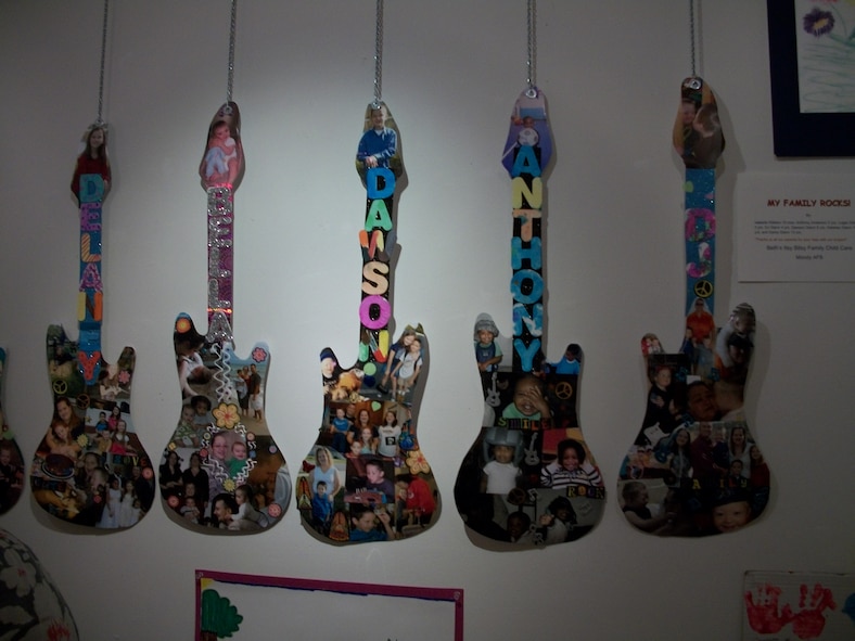 VALDOSTA, Ga. -- Guitar-shaped artwork by Moody children hangs on display at the Annette Howell Turner Center for the Arts. Children and youth who are part of the Family Child Care Program, Child Development Center and Youth Programs are featured artists at the center through Aug. 4. (Contributed photo by Karen White/RELEASED)