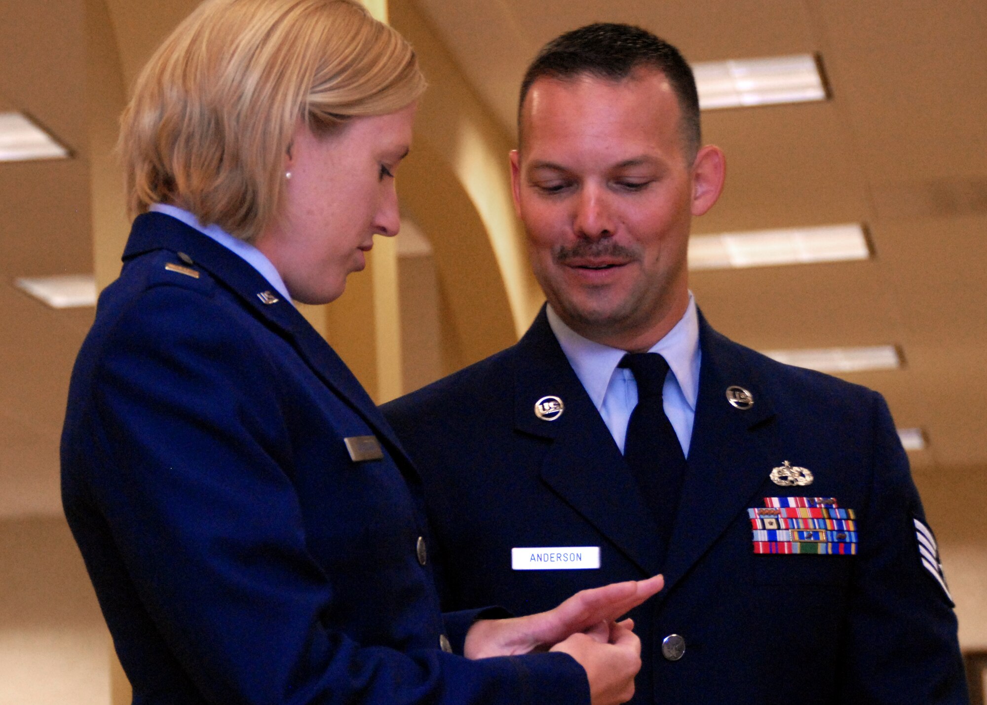 2nd Lt. Angela Anderson, 96th Inpatient Squadron, admires her new ring her husband Staff Sgt. Jake Anderson, 1st Special Operations Component Maintenance Squadron, gave her prior to renewing their vows at a surprise ceremony July 26 at Eglin Air Force Base, Fla.  Sergeant Anderson surprised his wife by putting together an official military-style wedding for their first anniversary.  (U.S. Air Force photo/Samuel King Jr.)