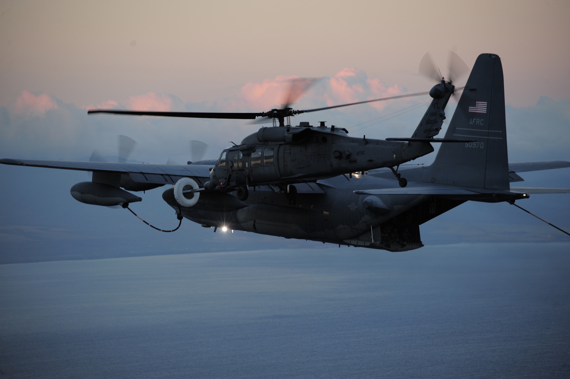 HICKAM AIR FORCE BASE, Hawaii - Three HH-60G Pave Hawk helicopters and two HC-130P/N Hercules aircraft from the 920th Rescue Wing, Patrick Air Force Base participate in the Rim of the Pacific (RIMPAC) exercise July 17 through August 2nd in  Hawaii.The HH-60Gs mid-air refuling capibility, shown here, provides reserve rescue crews with virtually unlimited range. The mission of the 920th is search for, locate and recover U.S. Armed Forces personnel during military operations. Their arrival at Hickam allows them to enter the exercise during the tactical phase where participants will transition into the execution of a warlike scenario consisting of unscheduled events where participants will have the opportunity to operate as they would during actual real world contingency or combat operations. 
