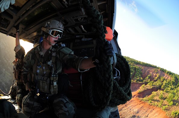 HICKAM AIR FORCE BASE, Hawaii - Staff Sgt. William Cenna, a reserve pararescueman with the 920th Rescue Wing based out of Patrick Air Force Base, Fla., participates in the Rim of the Pacific (RIMPAC) exercise being held in Hawaii. RIMPAC is a series of multinational maritime exercises held biannually and is in its 22nd year. The mission of the 920th RQW is search for, locate and recover U.S. Armed Forces personnel during military operations. Their arrival at Hickam allows them to enter the exercise during the tactical phase where participants will transition into the execution of a warlike scenario consisting of unscheduled events where participants will have the opportunity to operate as they would during actual real world contingency or combat operations. (U.S. Air Force photo/Master Sgt. Rob Grande)
