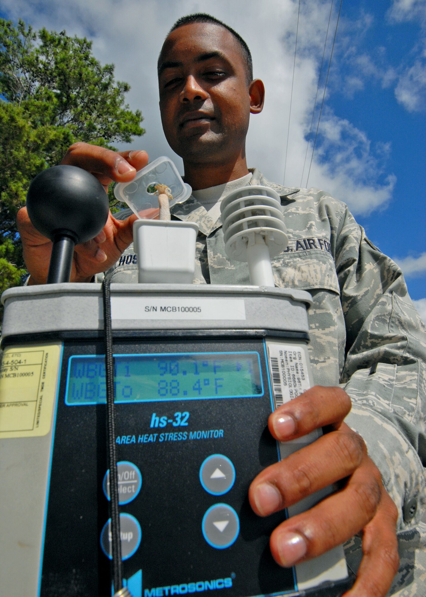 Senior Airman Ryan Hosten, 96th Aeropace Medicine Squadron, checks the water level in the Wet Bulb Globe Temperature detector July 27 at Eglin Air Force Base, Fla.  The WBGT is what the Air Force uses as the "heat index." The heat index is influenced by air temperature, radiant heat and humidity. It is also adjusted for the contributions of work demands, clothing and acclimatization.  (U.S. Air Force photo/Samuel King Jr.) 