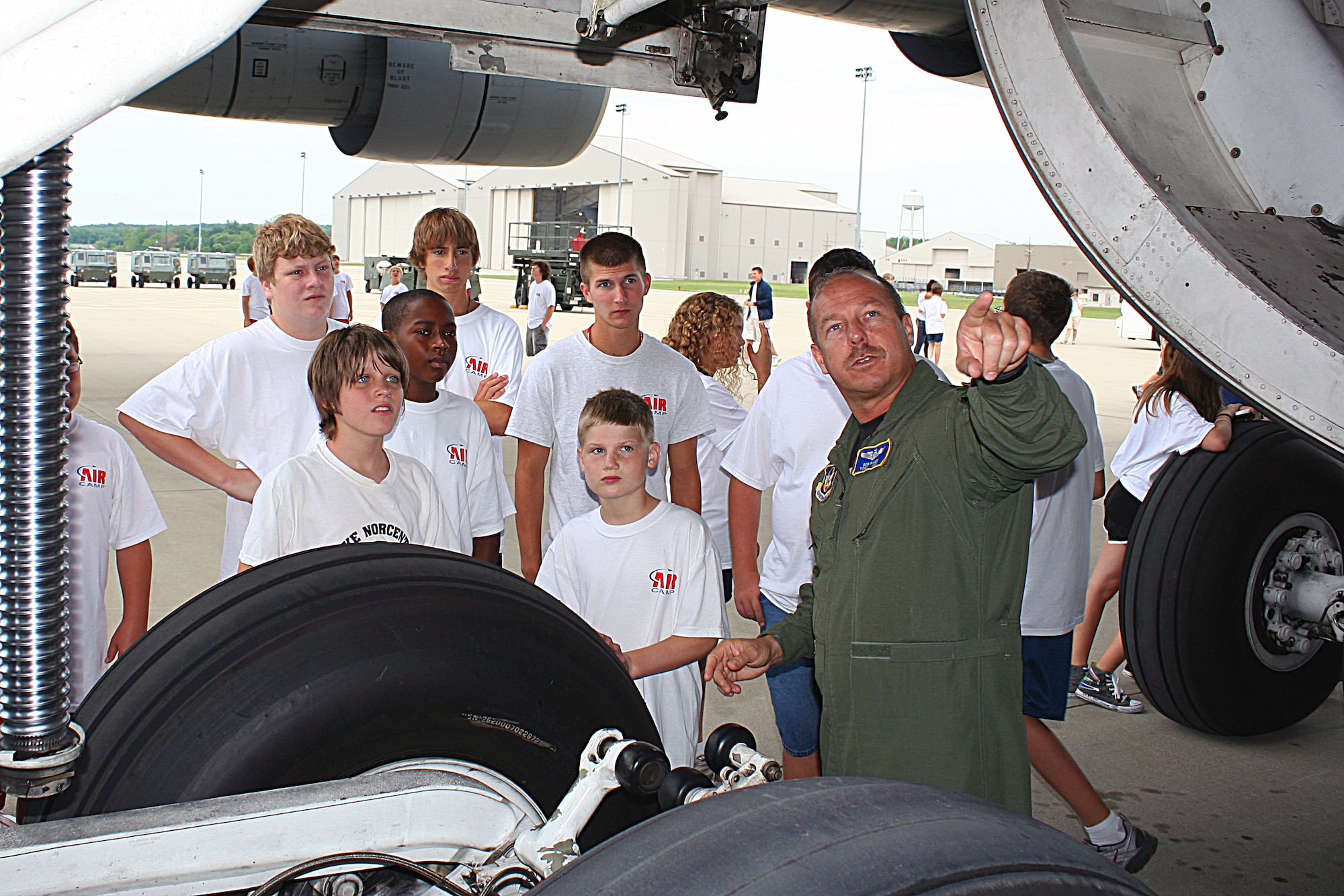WRIGHT-PATTERSON AIR FORCE BASE, Ohio -Tech. Sgt. Ron Baker, 89th Airlift Squadron, shows students from Air Camp the mechanics of a C-5 Galaxy aircraft during the group’s visit to the 445th Airlift Wing July 20. Air Camp is a new week-long summer camp for middle school students to learn about aviation and the science, technology, engineering and mathematics of aeronautics. (U.S. Air Force photo/Senior Airman Mikhail Berlin)