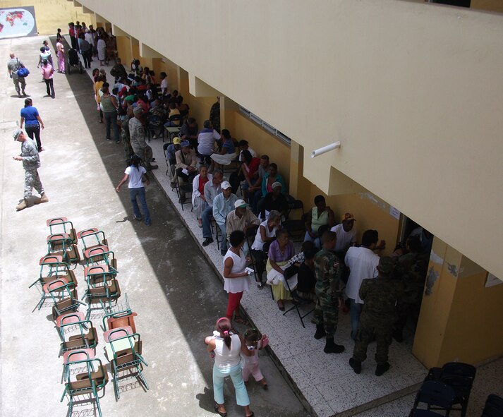 Citizens of Constanza, Dominican Republic, wait patiently to see Air Force Reserve Command and Dominican providers during 2010 MEDRETE July 10-24. Thirty-nine Air Force Reserve medics with the 512th Aerospace Medicine Squadron, Dover Air Force Base, Del., as well as doctors fromt he Dominican Republic, provided free medical care to more than 8,000 patients during the two-week medical training exercise. (U.S. Air Force photo/Col. Walton Reddish)