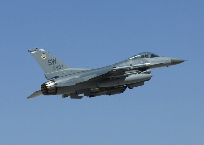 NELLIS AIR FORCE BASE, Nev. -- An F-16 from the 77th Fighter Squadron, Shaw Air Force Base, S.C. soars through the air at Red Flag-Nellis July 21, 2010. Red Flag is a realistic combat training exercise involving the air forces of the United States and its allies. The exercise is hosted north of Las Vegas on the Nevada Test and Training Range--the U.S. Air Force's premier military training area with more than 12,000 square miles of airspace and 2.9 million acres of land. With 1,900 possible targets, realistic threat systems and an opposing enemy force that cannot be replicated anywhere else in the world, Nellis and the NTTR are the home of a "peacetime battlefield," providing combat air forces with the ability to train to fly, fight and win together. (U.S. Air Force photo by Airman 1st Class Daniel Phelps)