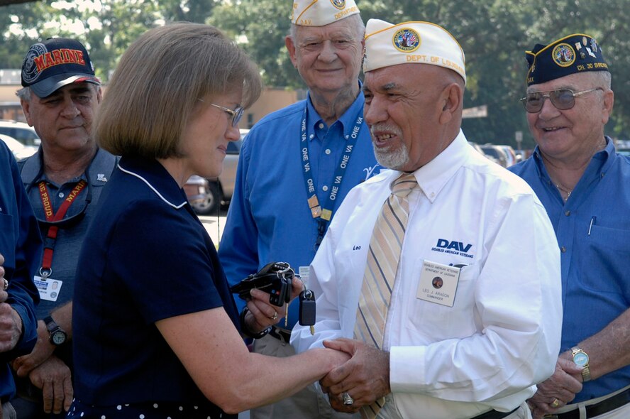 Dr. Virginia Short, acting Medical Center director accepts vehicle keys from Leo Aragon, Disabled American Veterans Department of Louisiana, commander at the Veteran Association Medical Center July 26. Two 2010 Ford Explorer were donated by the Disabled American Veterans Chapter 30 with financial assistance from Barksdale’s Air Force Sergeants Association, Chapter 615. (U.S. Air Force photo by Senior Airman Brittany Y. Bateman)