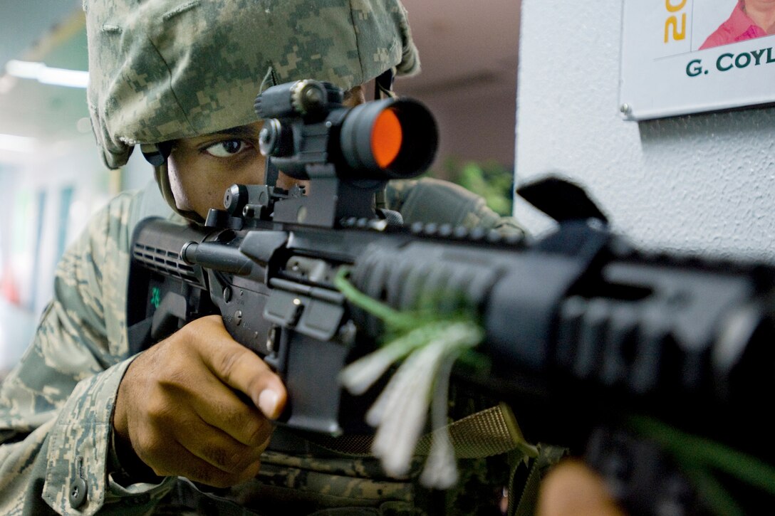 Airman 1st Class Steven Howard Jr. performs rear security during high-risk response training July 22, 2010, at Misawa Air Base, Japan. The five-day program was also a train-the-trainer course, allowing 35th Security Forces Squadron Airmen to take their newly learned skills and share their knowledge with co-workers. Airman Howard is a patrolman assigned to the 35th Security Forces Squadron at Misawa Air Base, Japan. (U.S. Air Force photo/Senior Airman Jamal D. Sutter)