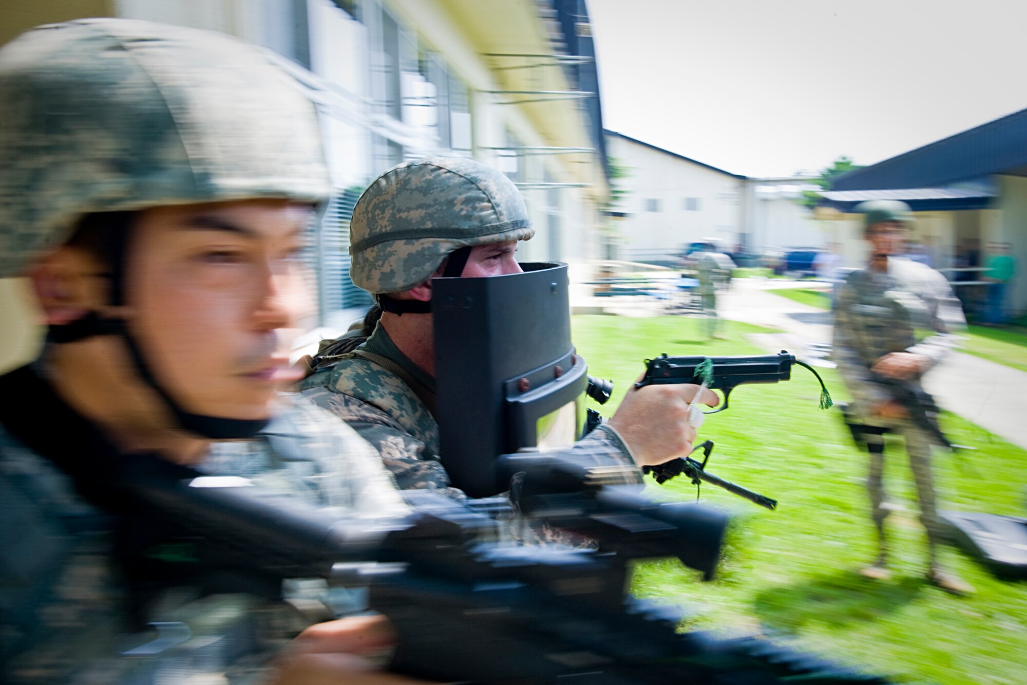 Staff Sgt. Dennis Mathys, left, and Staff Sgt. John Havens practice rescue-team drills during high-risk response training July 22, 2010, at Misawa Air Base, Japan. Air Force requirements for improved active shooter training allowed security forces Airmen and Sailors to attend the Pacific Air Forces command's HRRT program July 19 through July 23. Sergeants Mathys and Havens are assigned to the 35th Security Forces Squadron at Misawa AB, Japan. (U.S. Air Force photo/Senior Airman Jamal D. Sutter)