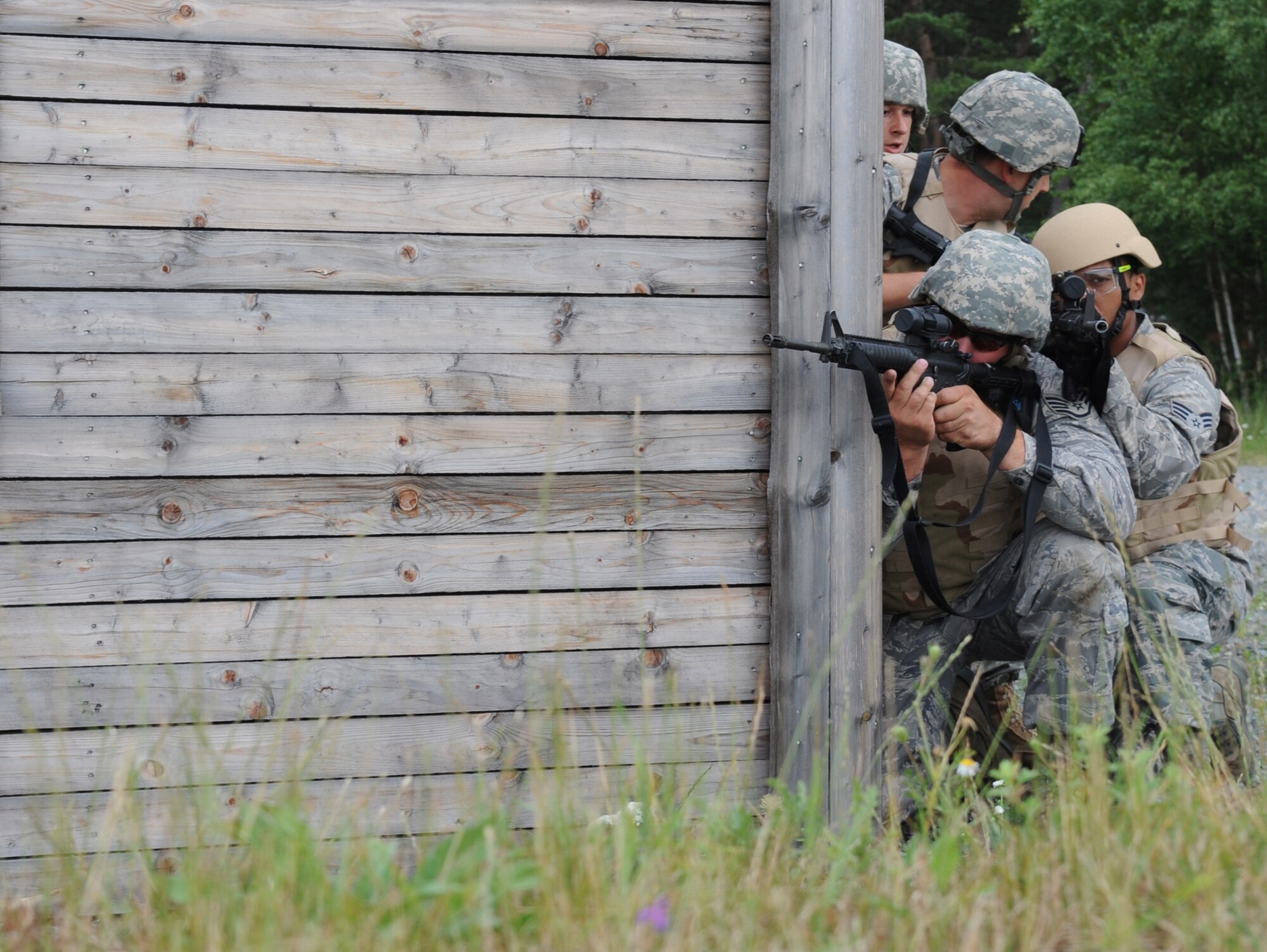 U.S. Air Force Airmen participate in urban close combat training during exercise ALLIED STRIKE 10, Grafenwoehr, Germany, July 26, 2010. AS 10 is Europe's premier close air support (CAS) exercise, held annually to conduct robust, realistic CAS training that helps build partnership capacity among allied North Atlantic Treaty Organization nations and joint services while refining the latest operational CAS tactics. For more ALLIED STRIKE information go to www.usafe.af.mil/alliedstrike.asp. (U.S. Air Force photo by Senior Airman Caleb Pierce)