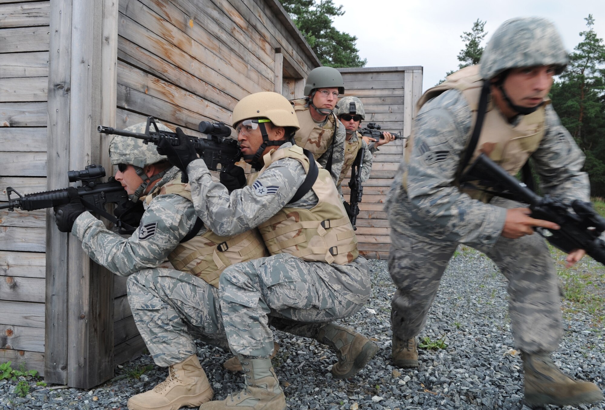 U.S. Air Force Airmen participate in urban close combat training during exercise ALLIED STRIKE 10, Grafenwoehr, Germany, July 26, 2010. AS 10 is Europe's premier close air support (CAS) exercise, held annually to conduct robust, realistic CAS training that helps build partnership capacity among allied North Atlantic Treaty Organization nations and joint services while refining the latest operational CAS tactics. For more ALLIED STRIKE information go to www.usafe.af.mil/alliedstrike.asp. (U.S. Air Force photo by Senior Airman Caleb Pierce)