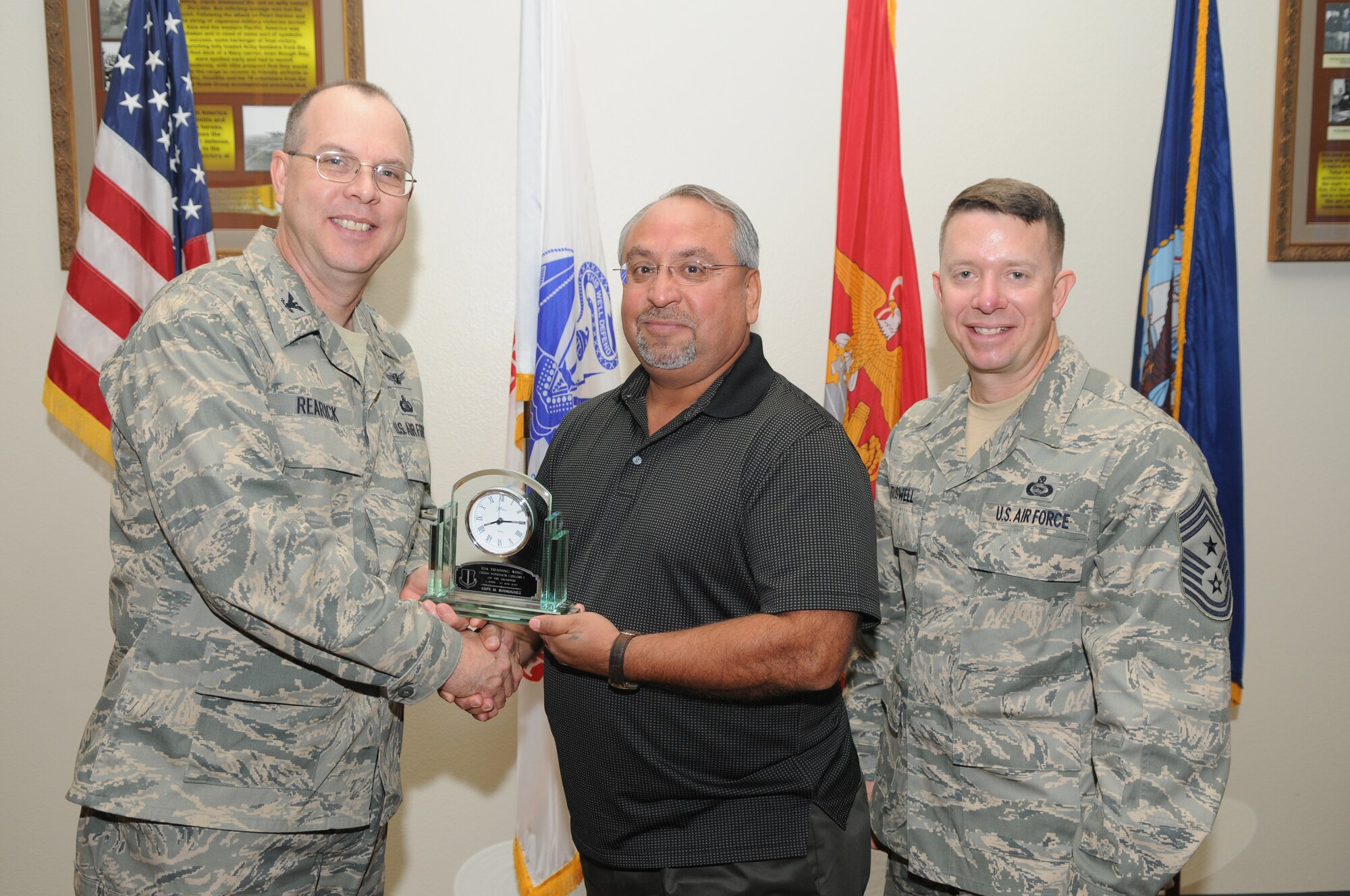 GOODFELLOW AIR FORCE BASE, Texas -- Lupe Rodriguez, 17th Mission Support Group, receives 17th Training Wing Civilian of the Quarter Supervisor Category 1 during the wing quarterly awards ceremony July 27. (U.S. Air Force photo/Airman 1st Class Clayton Lenhardt) 