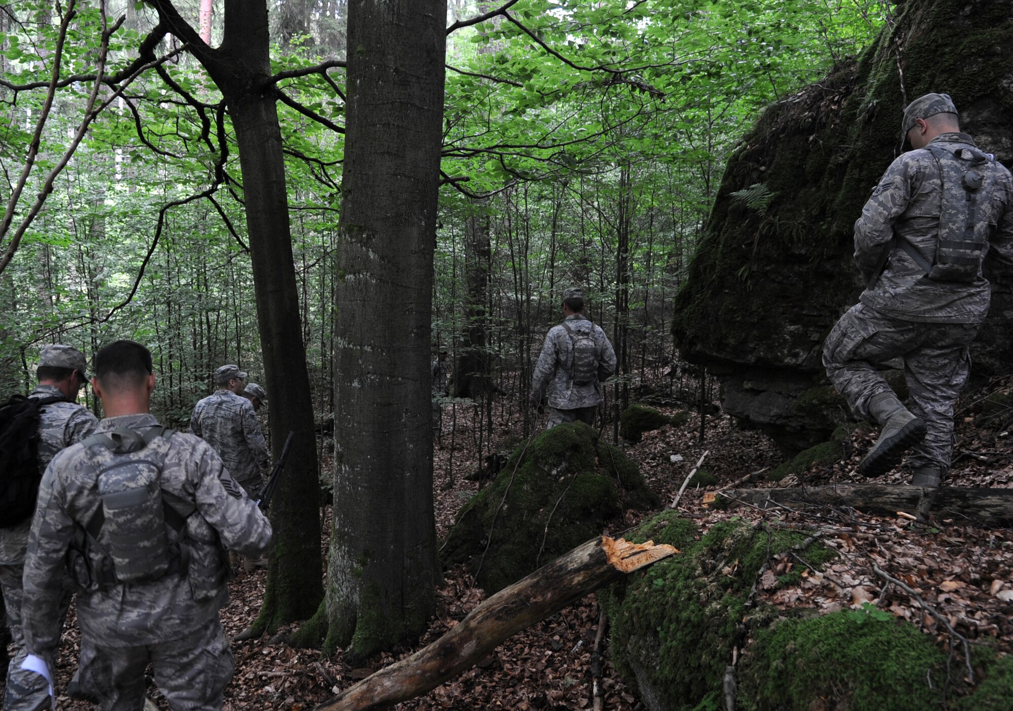 U.S. Air Force Airmen participate in a land navigation course during exercise ALLIED STRIKE 10, Grafenwoehr, Germany, July 25, 2010. AS 10 is Europe's premier close air support (CAS) exercise, held annually to conduct robust, realistic CAS training that helps build partnership capacity among allied North Atlantic Treaty Organization nations and joint services while refining the latest operational CAS tactics. For more ALLIED STRIKE information go to www.usafe.af.mil/alliedstrike.asp. (U.S. Air Force photo by Senior Airman Caleb Pierce)