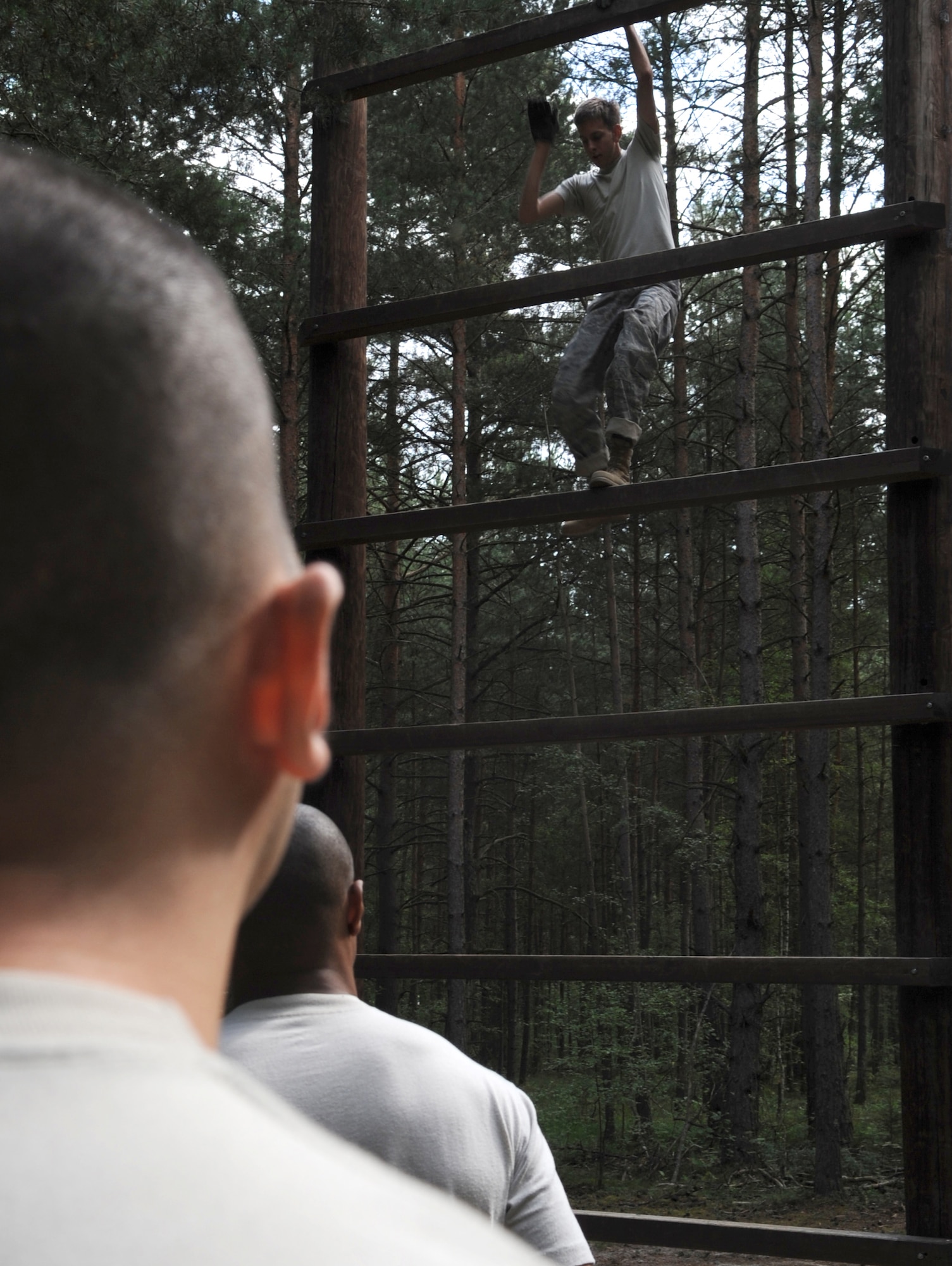 U.S. Air Force Staff Sgt. Nicholas Nelson, 8th Air Support Operations Squadron radio frequency transmission journeyman,stationed at Aviano Air Base, Italy, attempts to complete an obstacle during ALLIED STRIKE 10, Grafenwoehr, Germany, July 23, 2010. AS 10 is Europe's premier close air support (CAS) exercise, held annually to conduct robust, realistic CAS training that helps build partnership capacity among allied North Atlantic Treaty Organization nations and joint services while refining the latest operational CAS tactics. For more ALLIED STRIKE information go to www.usafe.af.mil/alliedstrike.asp. (U.S. Air Force photo by Senior Airman Caleb Pierce) 