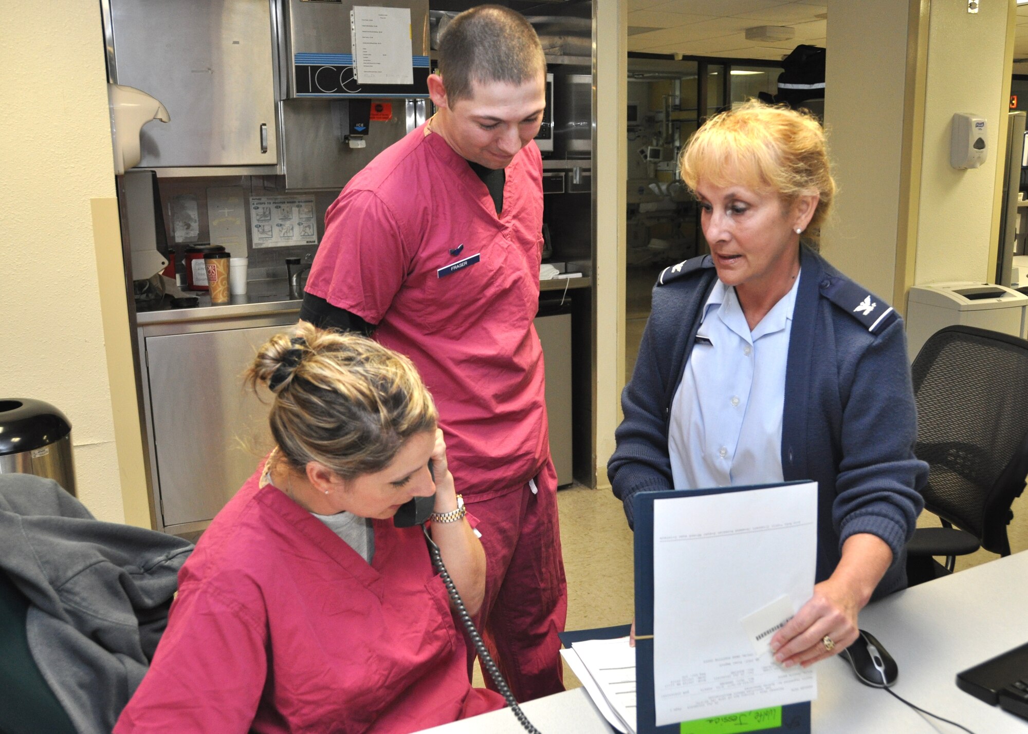 Col. Allison Plunk, right, new 81st Medical Group chief nurse, discusses a patient with Capt. Shelly Meiners, an 81st Inpatient Operations Squadron critical care nurse, and Airman 1st Class Joseph Fraser, an 81st Medical Operations Squadron respiratory therapist, during a July 26 visit to the 81st MDG Hospital’s intensive care unit.  Colonel Plunk, former 81st IPTS commander, assumed her new post upon the July 22 retirement of Col. Cassandra Salvatore.  (U.S. Air Force photo by Steve Pivnick)
