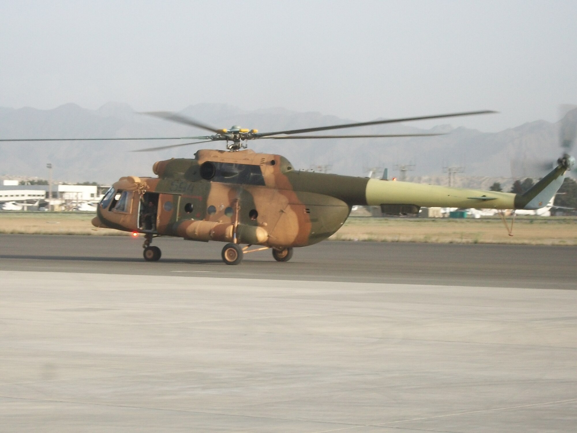 ORGUN-E, Afghanistan - Mi-17 number 594 returns to the Afghan Air Force base in Kabul after a team of contractors, CAPTF mentors, and AAF maintainers replaced the tailboom. (U.S. Military photo/RELEASED).


