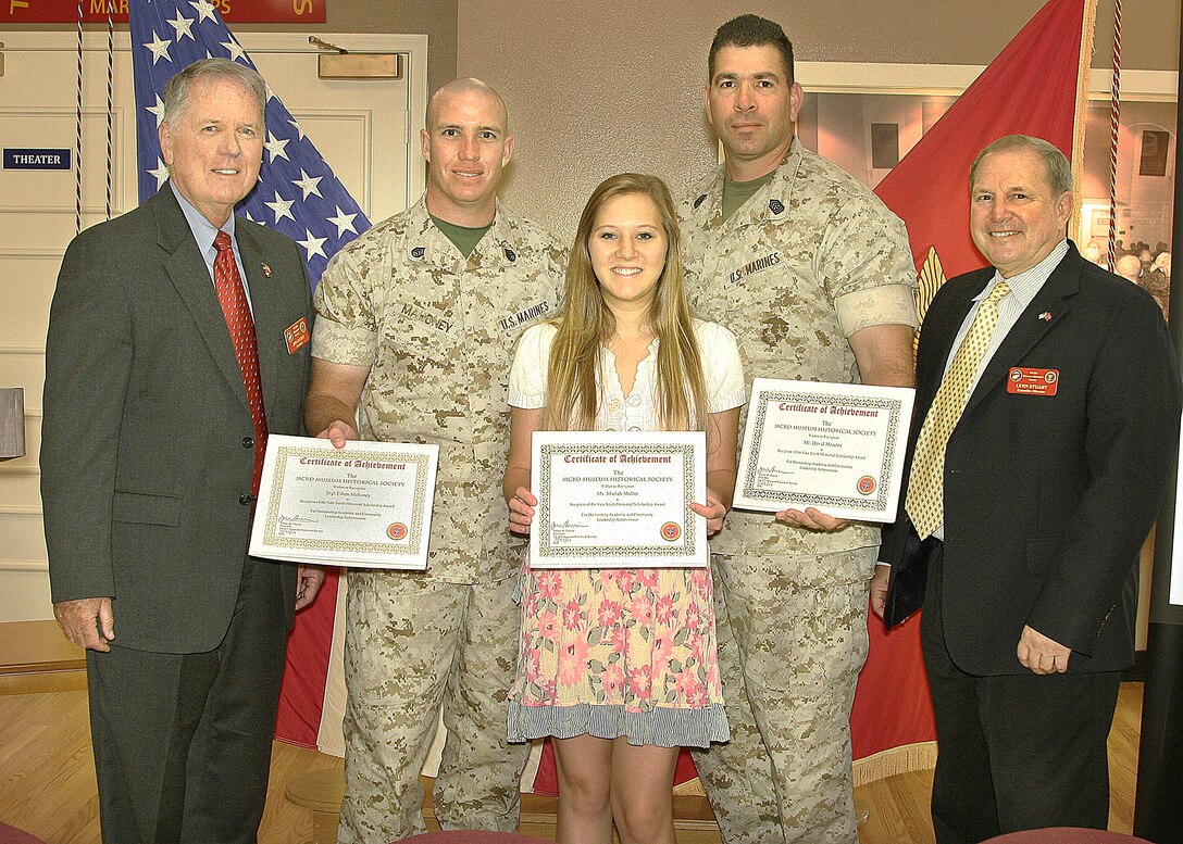 Colonel Nate Smith Scholarship recipients and family members present their Certificates of Achievement at the Marine Corps Recruit Depot Museum Historical Society's Quartley Breakfast at the Visitor's Reception Center in the Depot Museum, July 27.