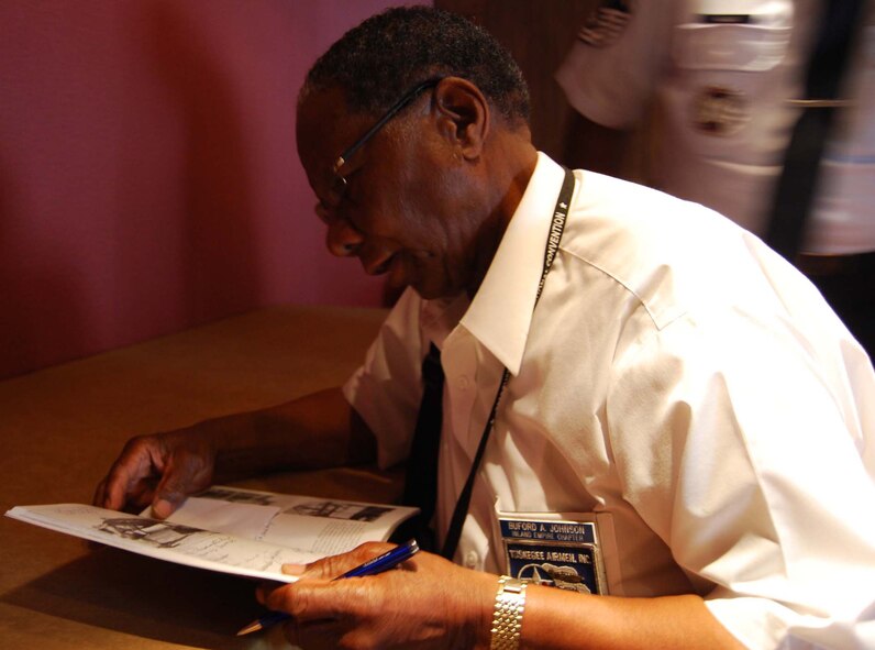 Attendees of the 39th annual Tuskegee Airmen Convention spent registration day getting signed in and talking with members of the Tuskegee Airmen. Expected at the convention are about 150 original Tuskegee Airmen who hope to highlight this year's focus of continuing to carry on the traditions of the Tuskegee Airmen of meeting adversity with intelligence and commitment. The Youth Day portion of this year's convention hopes to bring awareness of aviation careers to potential future pilots and crew members. ( U.S. Air Force Photo by Senior Airman Viola M. Hernandez) 