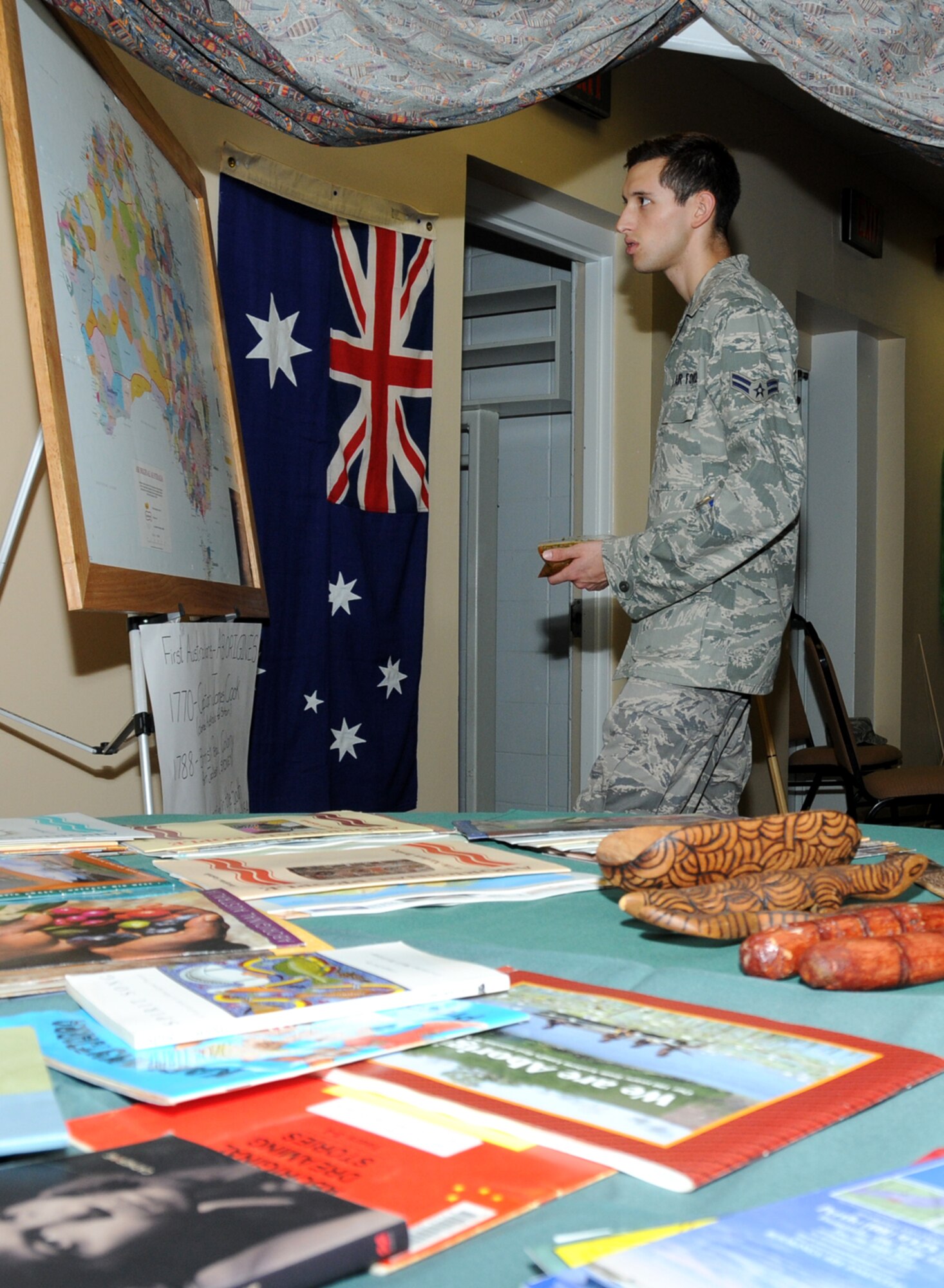 Airman 1st Class Stephen Montgomery, 81st Medical Operations Squadron, checks out the Australia display during Diversity Day, July 20 at the Dragon's Lair.  (U.S. Air Force photo by Kemberly Groue)