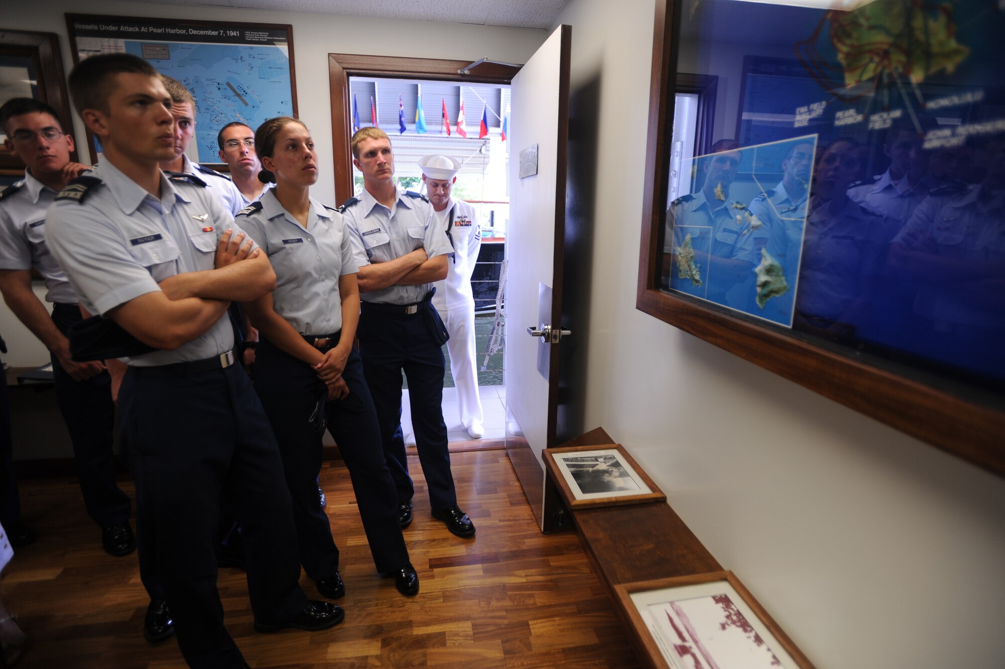 JOINT BASE PEARL HARBOR HICKAM, Hawaii - Cadets from the Air Force Academy view a map Oahu marked with routes the Japanese planes took in the 1941 Pearl Harbor attack during the Boathouse Tour as part of Operation Air Force here, July 15. The 15th Wing mission mentor program involved time spent with the 15th Medical Group, 15th Operations Group, 15th Maintenance Group, and 647th Air Base Group to gain an appreciation for the team effort required to accomplish the 15th WG mission. Additionally, the cadets took special tours of the 613th Air and Space Operations Center and Arizona Memorial, and were included in senior officer visits. (U.S. Air Force photo/Senior Airman Gustavo Gonzalez)