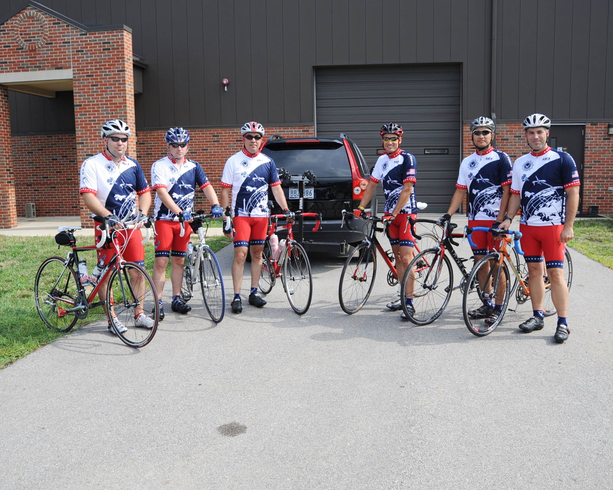 SCOTT AIR FORCE BASE, Ill. -- Members of Scott’s Cycling Team, Tech. Sgt. Josh Coggins, Senior Airman Michael Wilson, Master Sgt. Joseph Salomon, Lt. Col. Matt Roller. Tech. Sgt. Paul Ocampo and Chaplain (Capt.) Michael Carey, prepare before their departure to ride more than 400 miles in the Register's Annual Great Bicycle Ride Across Iowa. Updates on the team can be found via Facebook throughout the week under “Scott AFB Cycling.”  RAGBRAI continues through Saturday. (U.S. Air Force Photo by Airman 1st Class Tristin English)
