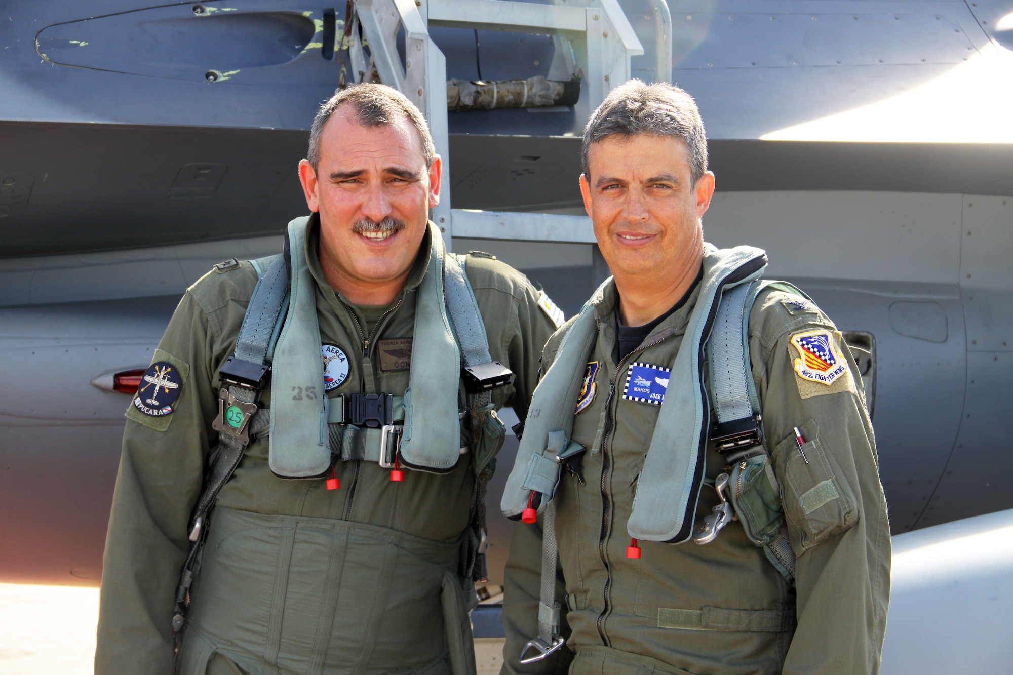 Uruguayan Air Force Col. Sergio Gonzalez, left, Commander, 2nd Air Brigade, and Col. Jose Monteagudo, Vice Commander, 482nd Fighter Wing, prepare to fly an F-16D of the 93rd Fighter Squadron July 28, 2010. Col. Gonzalez was one of five members of the Uruguayan Air Force who visited Homestead for three days as part of an ongoing exchange program aimed at fostering closer ties between the two nations. (U.S. Air Force photo/Ian Carrier)
