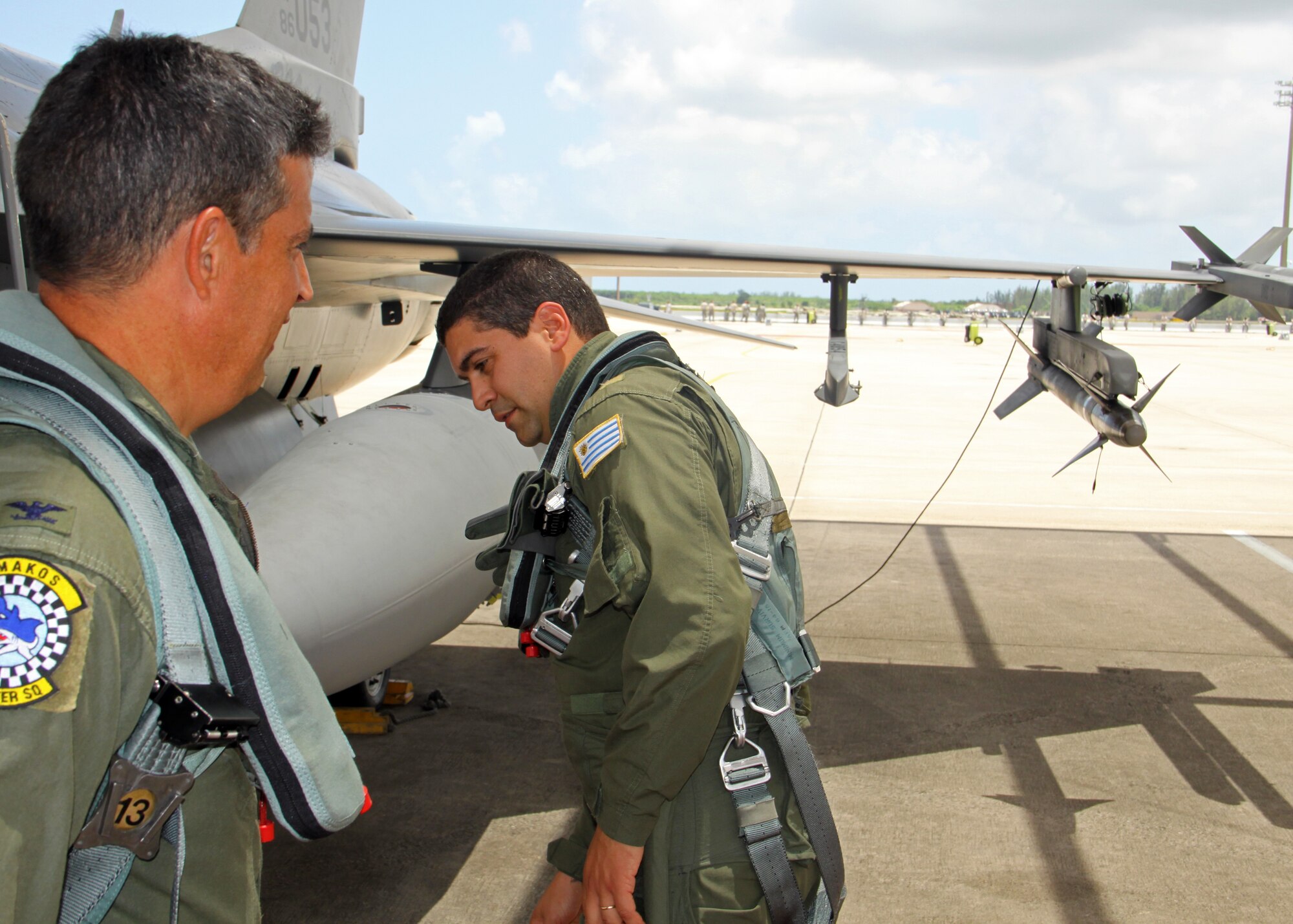 Uruguay Air Force Capt. Patrick Jaimez prepares for a subject matter expert exchange flight on Homestead Air Reserve Base, Fla,, July 26, 2010. The F-16D was piloted by Col. Jose Monteagudo, 482nd Fighter Wing Vice Commander. Capt. Jaimez was one of five Uruguayan Air Force pilots who took part in a three day visit to Homestead ARB as part of an ongoing exchange program. (U.S. Air Force photo/Ian Carrier)
