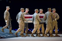A U.S. Marine Corps team transfers the remains of Marine Corps Gunnery Sgt. Christopher L. Eastman, of Seward, Alaska, at Dover Air Force Base, Del., July 20. (U.S. Air Force photo/Roland Balik)