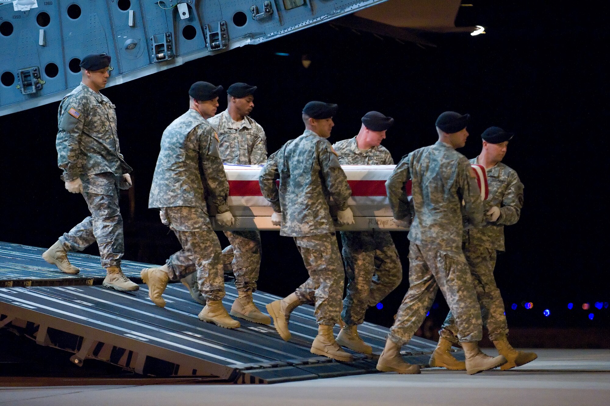 A U.S. Army carry team transfers the remains of Army Sgt. Anibal Santiago, of Belvidere, Ill., at Dover Air Force Base, Del., July 20. (U.S. Air Force photo/Roland Balik)